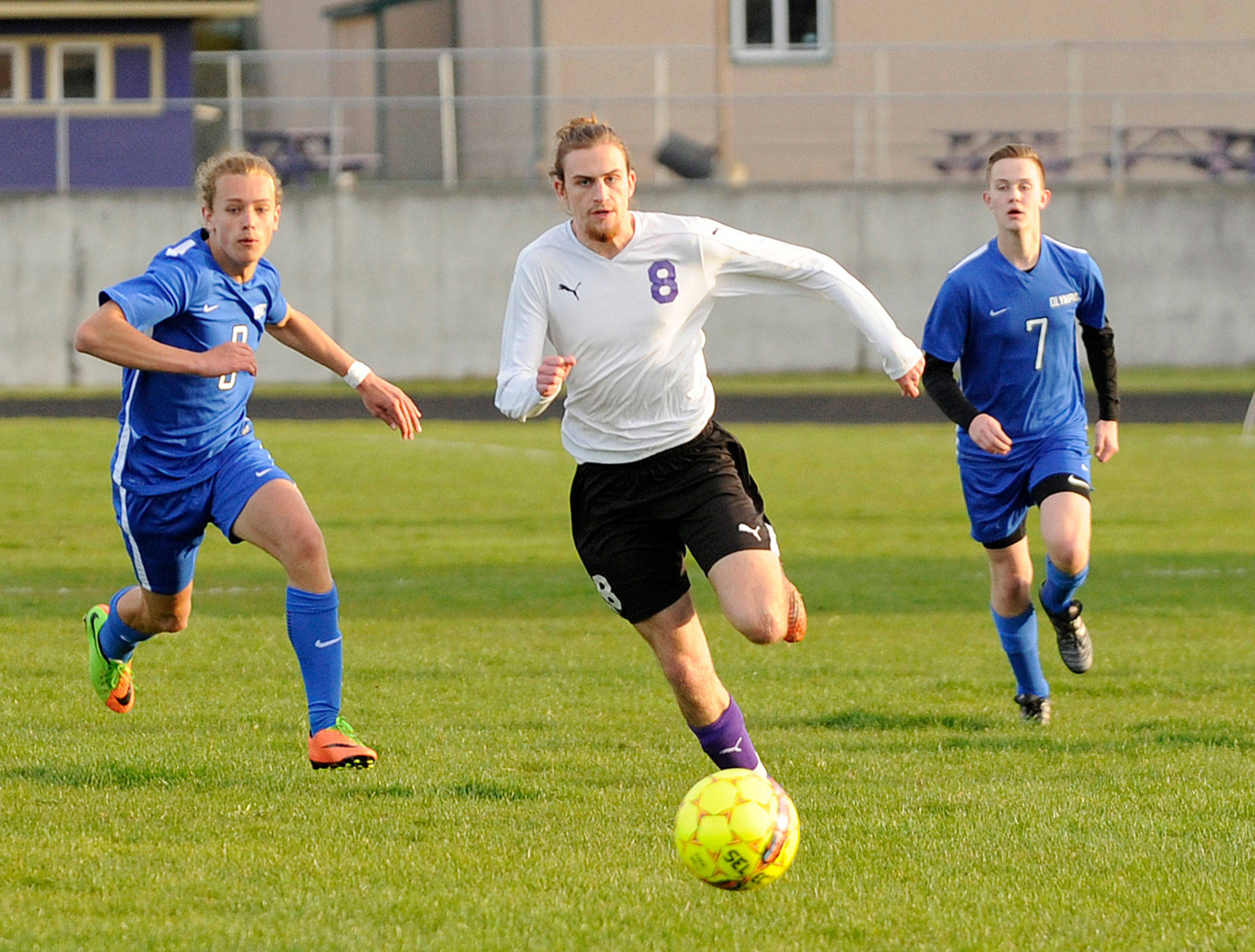 Liam Harris breaks free from Olympic defenders for a score in the Wolves 9-0 win on April 10, giving him 11 for the season. Harris is on from tying and two from breaking Kai Antrim’s school record for career goals (40). Sequim Gazette photo by Michael Dashiell