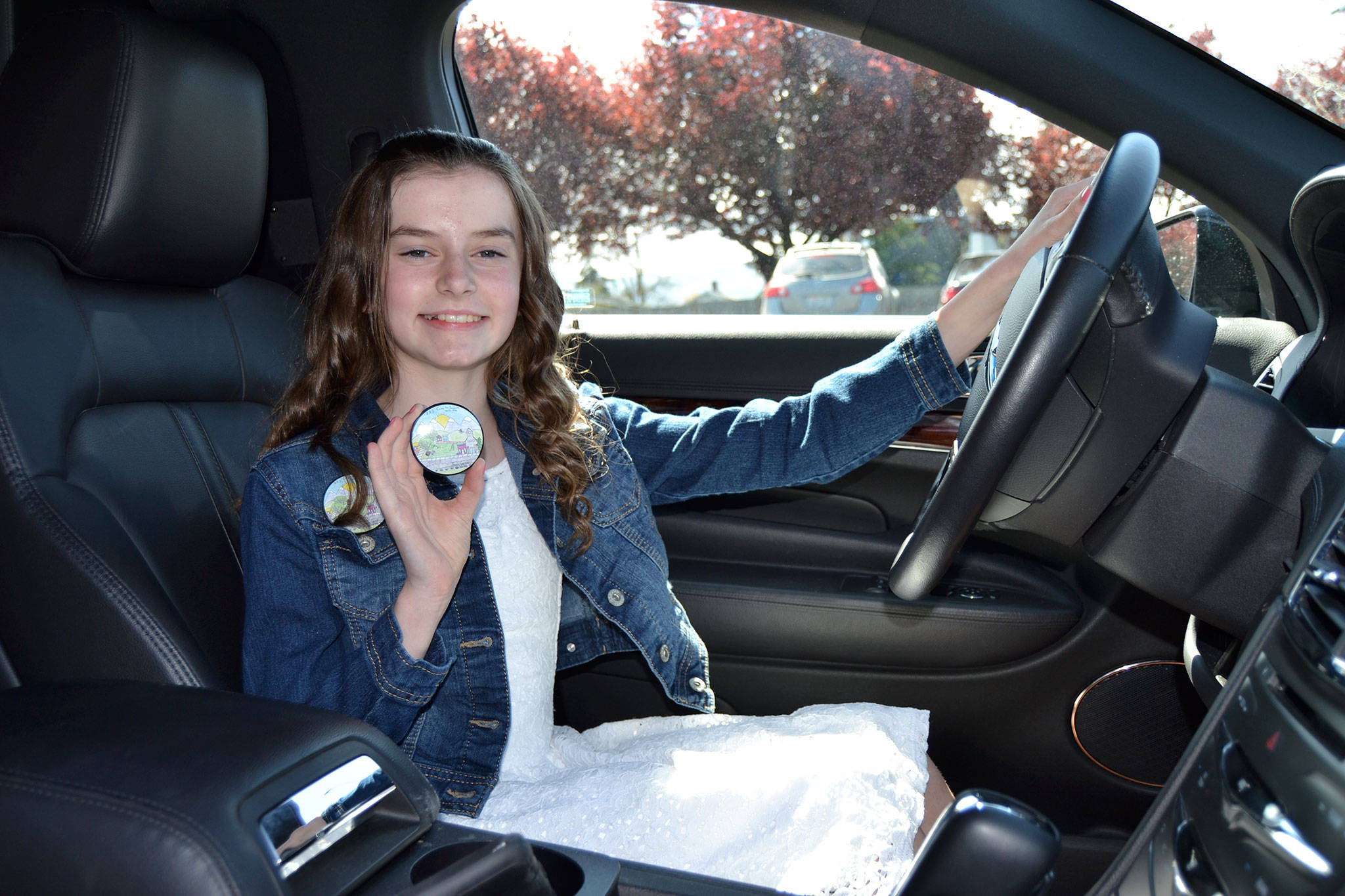 Sara German won this year’s Sequim Irrigation Festival button design contest and the chance to ride in a limo with friends to lunch on May 1. Sequim Gazette photo by Matthew Nash
