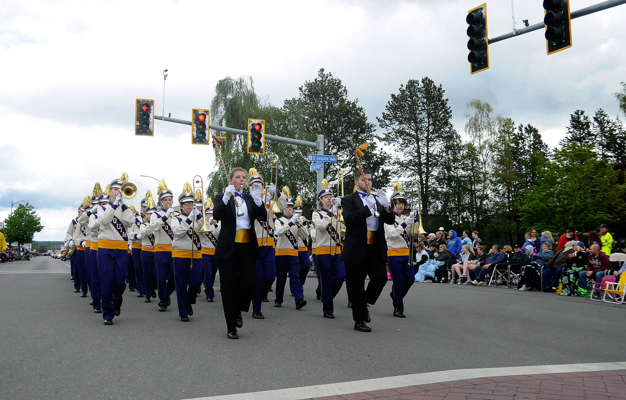 The Sequim High School Marching Band crosses Sequim Avenue in last year’s Sequim Irrigation Festival Grand Parade. This year they’ll make the trek along Washington Street as entry No. 18 on Saturday, May 12. Sequim Gazette file photo by Michael Dashiell