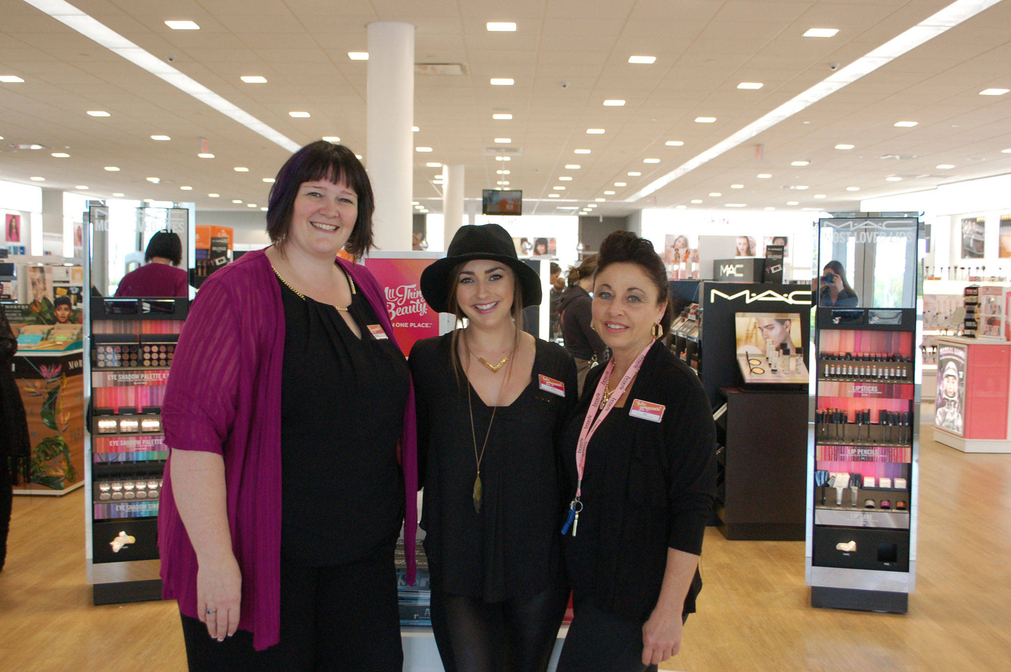 Sequim Ulta Beauty General manager Angela Moreau, lead M.A.C. artist Mimi Williams and Prestige manager Kim Ayers stand in the front of the new store located at 1065 W. Washington St. Sequim Gazette photo by Erin Hawkins