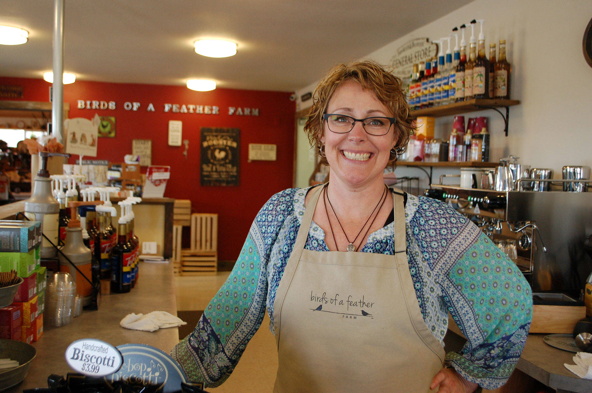 Kristi Grasser, owner of Birds of a Feather Farm stands in the renovated space that has been transformed from a business office into a coffee bar where her business will now offer organic coffee and all-natural ice cream. Sequim Gazette photo by Erin Hawkins