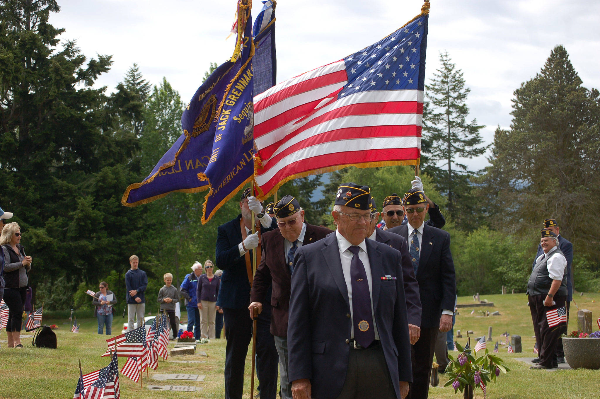 Members of Jack Grennan Post 62 of the American Legion lead with a series of flags at the Memorial Day ceremony at Sequim View Cemetery on May 28. Sequim Gazette photos by Erin Hawkins