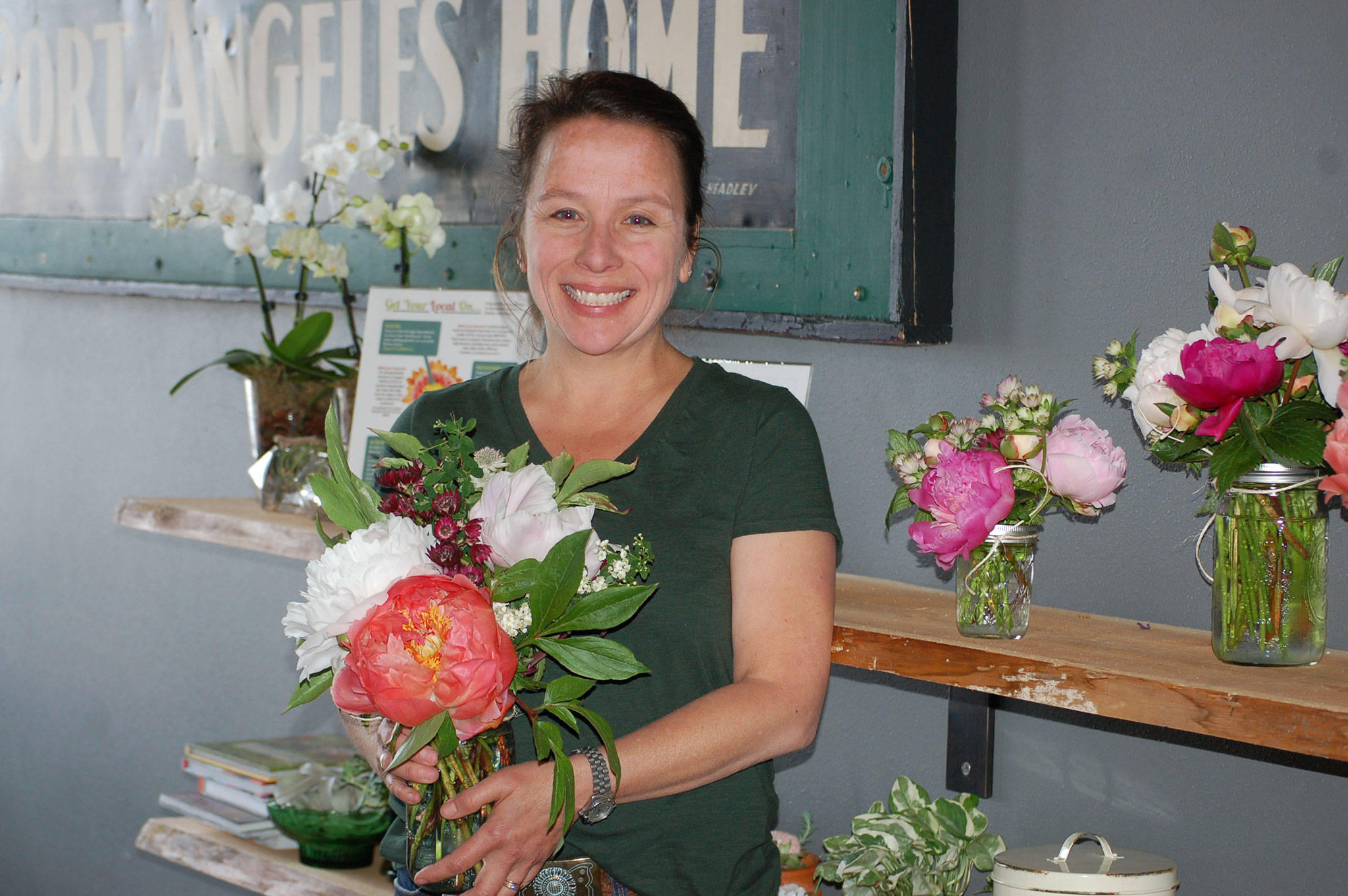 April Lemly, owner of Kamama Flowers, runs a flower bar in Peninsula Taproom open from 12-5 p.m. Tuesday through Friday. Sequim Gazette photo by Erin Hawkins