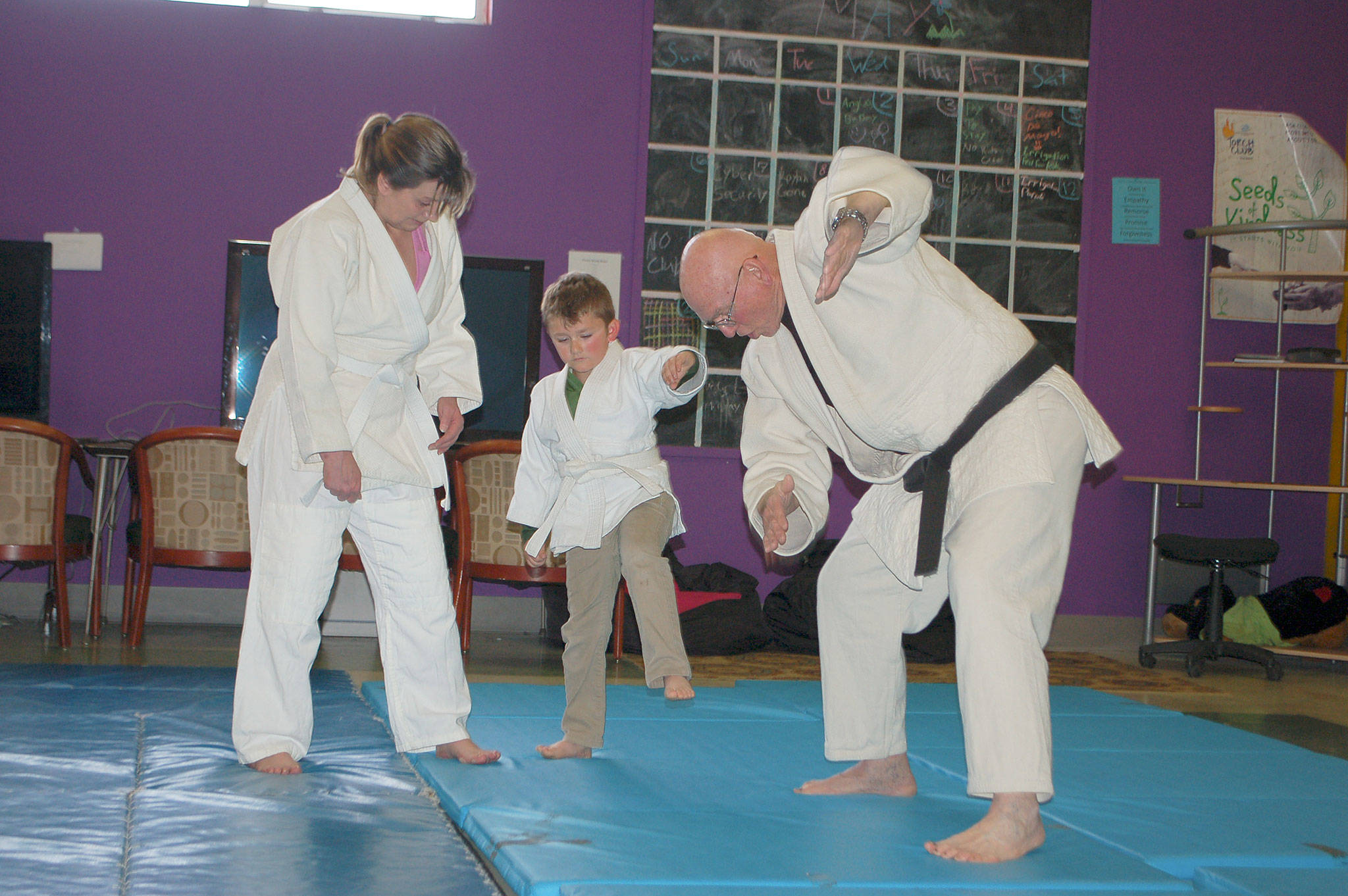 Judo instructors work with club member Olyver Van Selus during a judo class at the Boys & Girls Club Carroll C. Kendall unit in Sequim. Sequim Gazette photo by Erin Hawkins