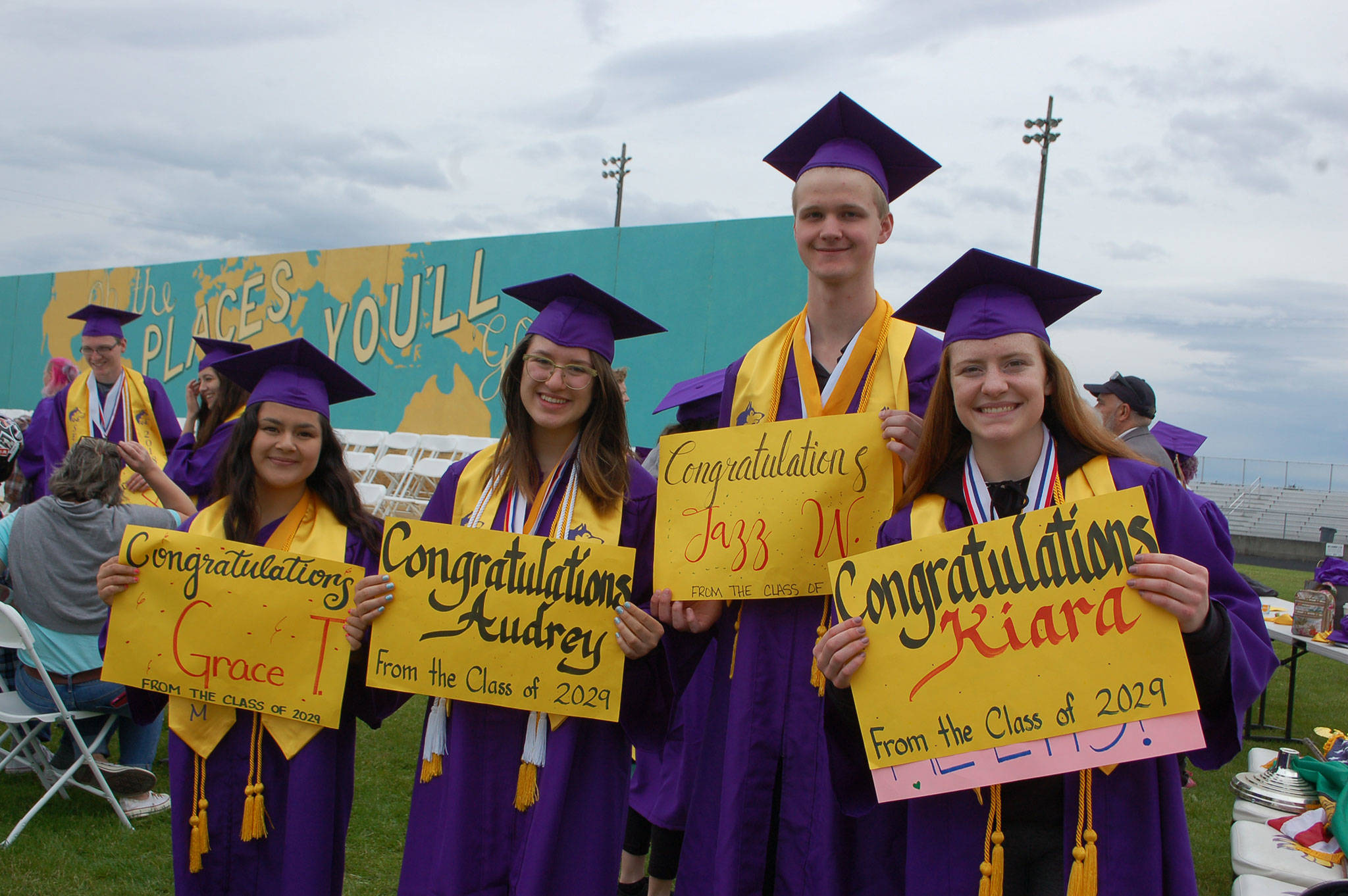 Sequim High School’s class of 2018 four valedictorians, Grace Tolberd, left, Audrey Hughes, Jazz Weller and Kiara Pierson, stand together at the track during graduation rehearsal on June 8. Sequim Gazette photo by Erin Hawkins