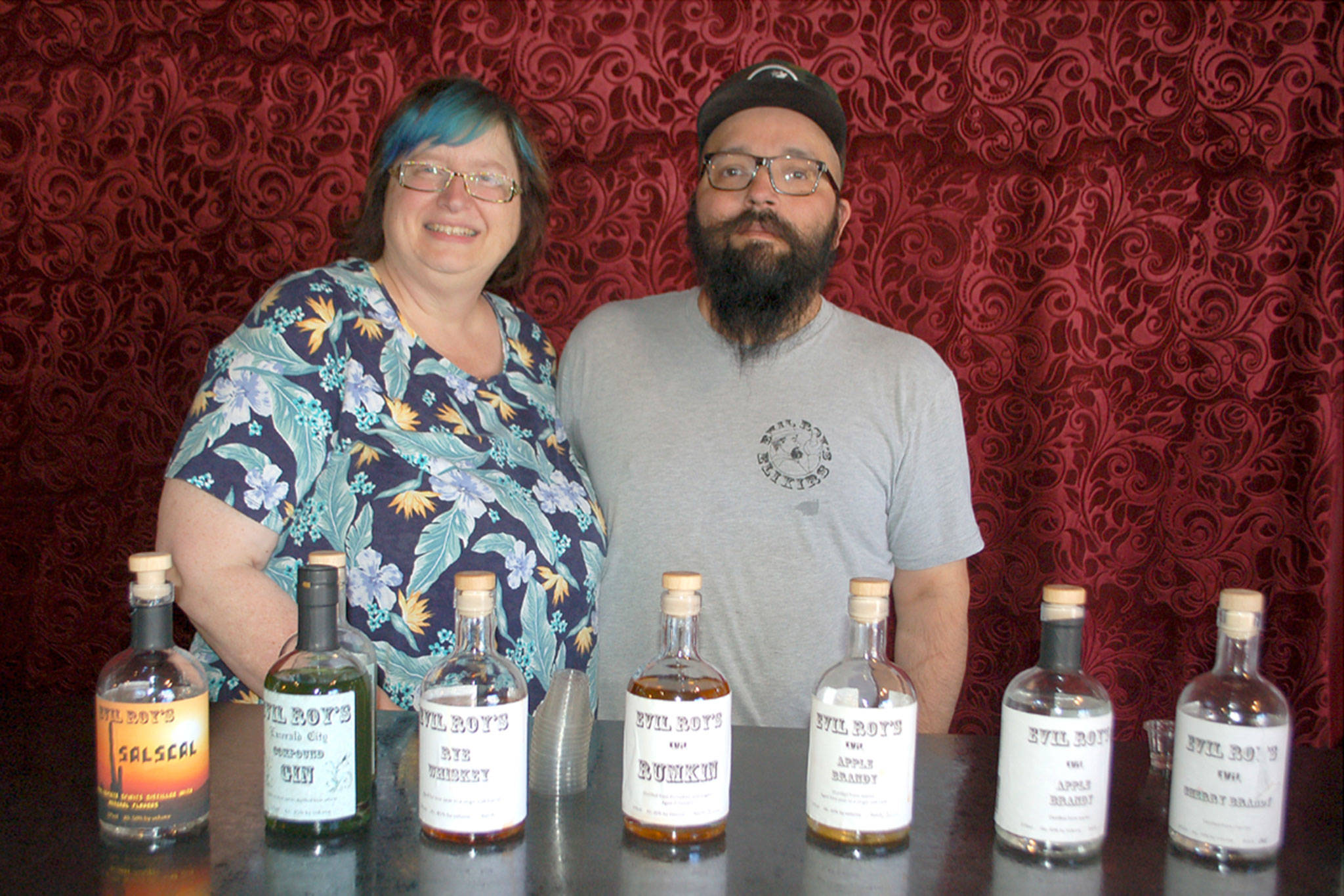 Janice and Eric Oster, owners of Evil Roy’s Distillery at 209 S. Sequim Ave. said distilling is what they love to do. Sequim Gazette photo by Erin Hawkins