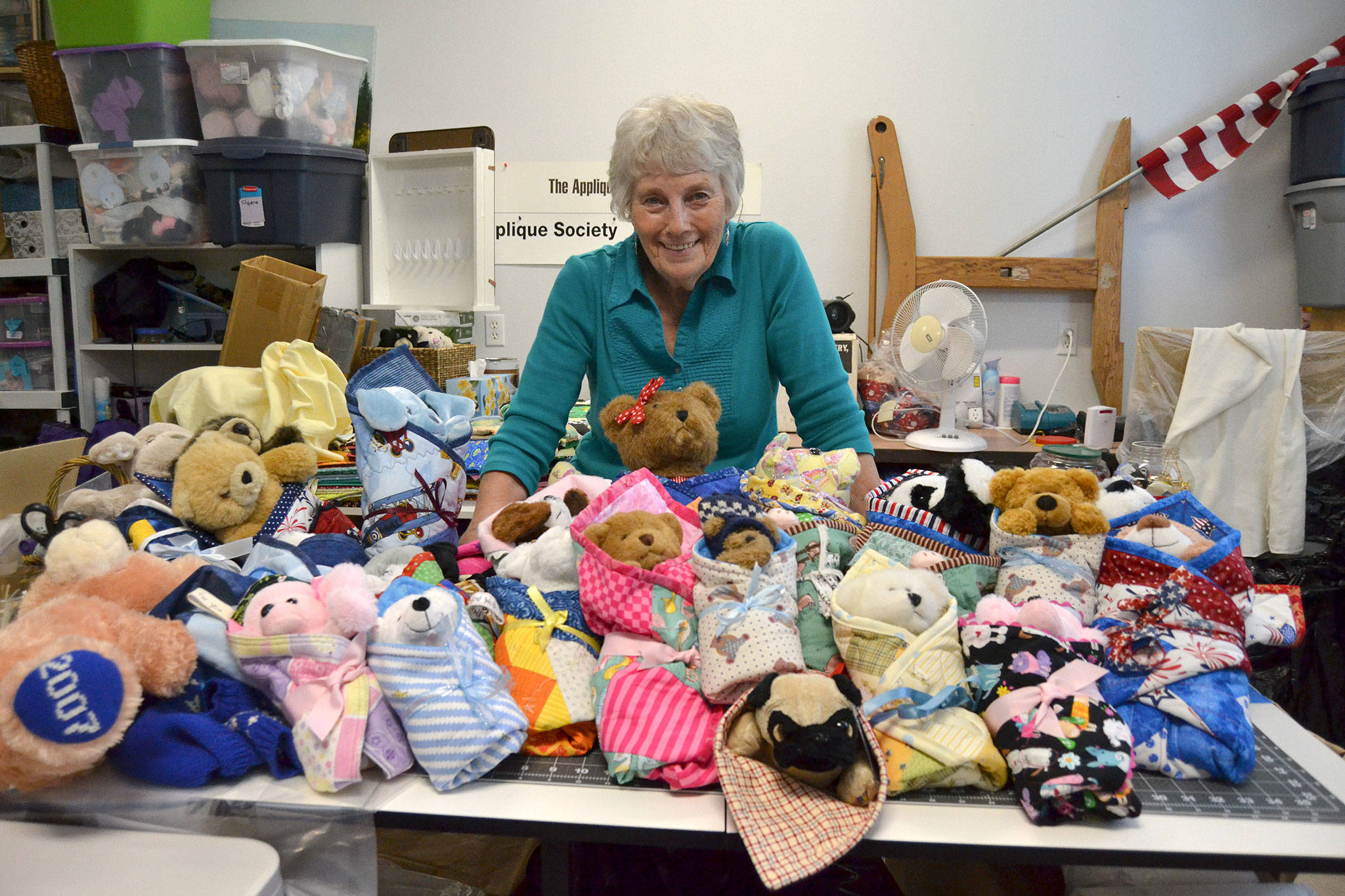 Since 2008, Loretta Bilow has coordinated Joy Quilts featuring stuffed animals wrapped in quilts for first responders and medical professionals to share with children experiencing trauma or unwelcome transition in their lives. She’s helped distribute more than 4,000 Joy Quilts in the area, in Washington and worldwide. Sequim Gazette photo by Matthew Nash