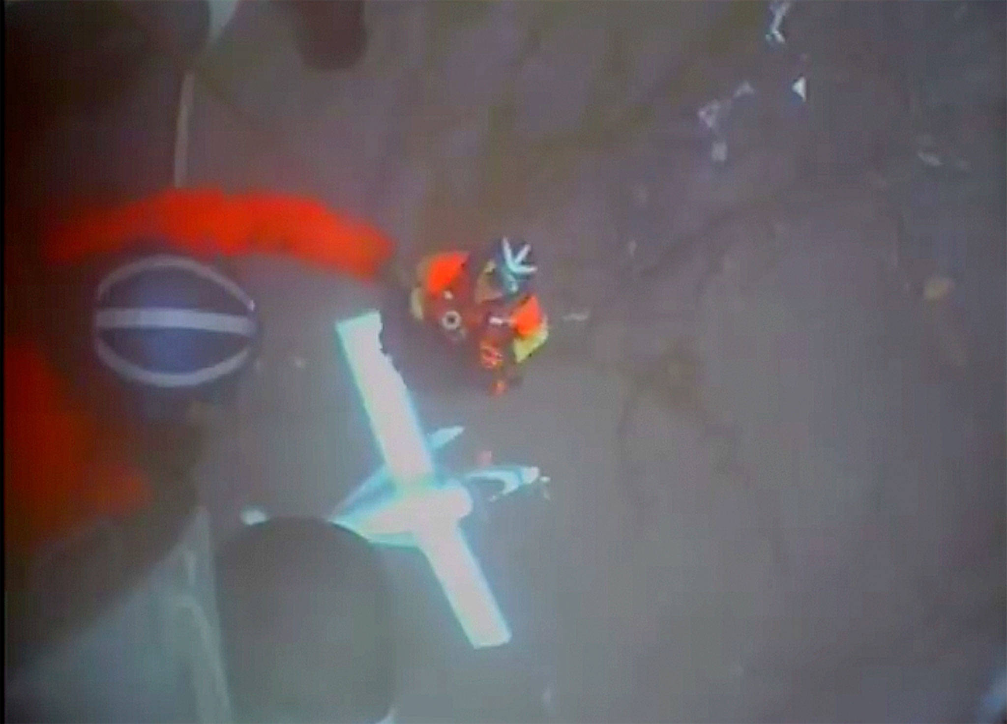 U.S. Coast Guard crewmen hoist a plane crash survivor from wreckage on July 10 near Ketchikan, Alaska. David Price of Sequim was one of 11 people on board to survive the crash. Photo by U.S. Coast Guard