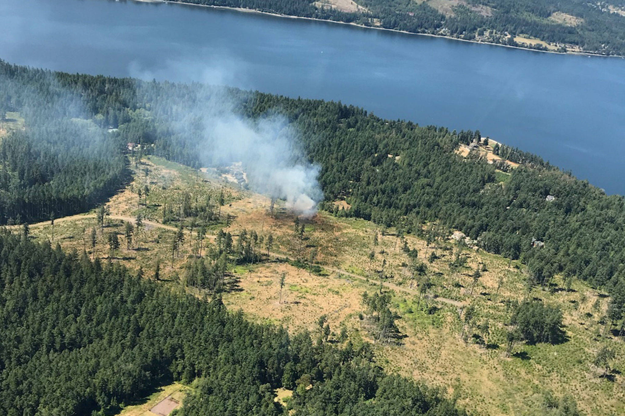 Local pilot Mike Radford shot a photo of the brush fire near Rhapsody Drive when he was in the area the same time the fire was dispatched by 911. Photo courtesy of Clallam County Fire District No. 3