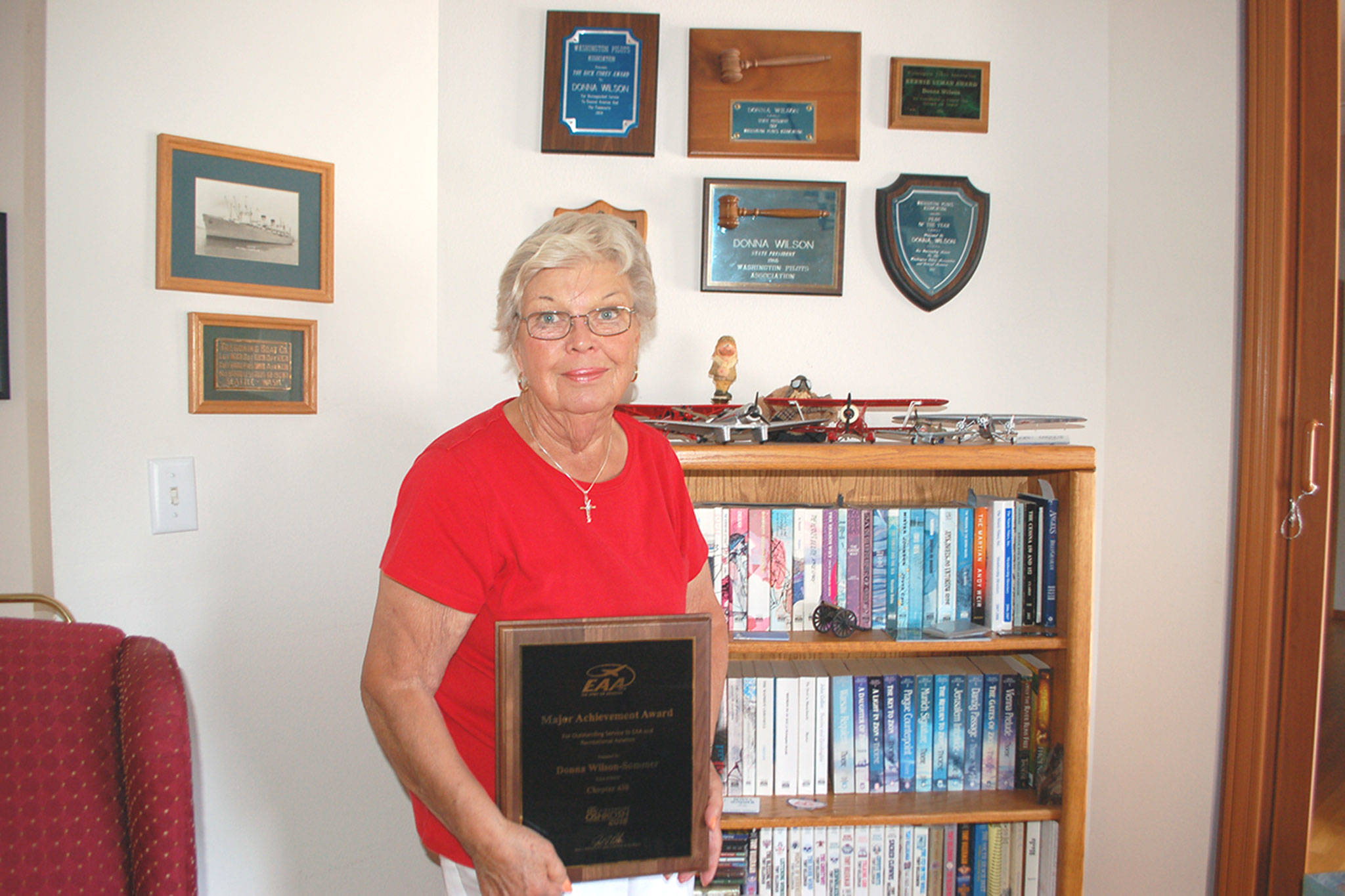 Among a handful of other aviation awards that hang on the walls of her home, Sequim’s Donna Wilson-Sommer is the Experimental Aircraft Association 2018 Major Achievement Award Winner for her many years of promoting aviation in her local communities. Sequim Gazette photo by Erin Hawkins