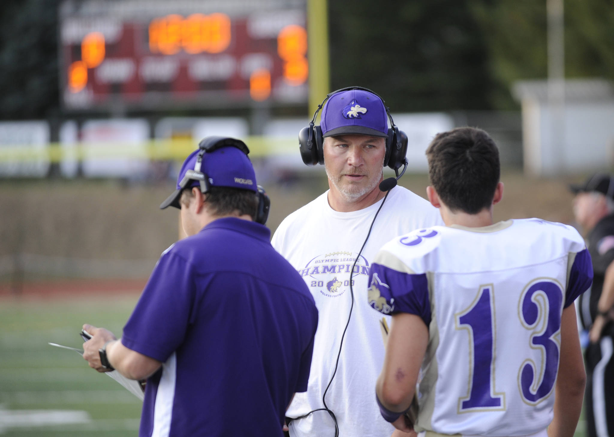 Sequim head coach Erik Wiker looks to a crop of young players to help fill key “skill” positions, including his sophomore son Taig (right). Sequim Gazette file photo by Michael Dashiell