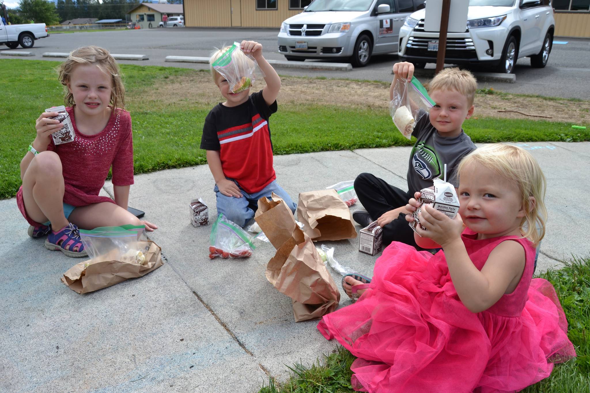 For lunch time it’s family time as Susan Coffee, not pictured, gathers her grandchildren, from left, Grace Dormer, 7, Sawyer Bushy, 4, Bradly Dormer, 5, and Malta Bushy, 2, at Carrie Blake Community Park on Aug. 27. Coffee said she and her grandchildren visited the park often to enjoy the Summer Food Program. Sequim Gazette photo by Matthew Nash