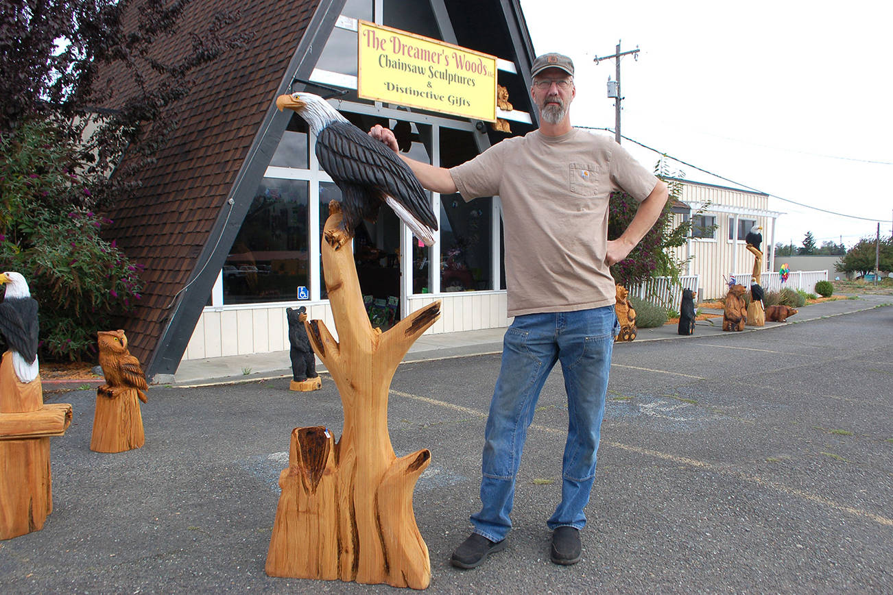 Chainsaw artist Eric Berson opened his retail shop The Dreamer’s Woods in Sequim at 618 E. Washington St. He started chainsaw sculpting 16 years ago in Alaska and sells a variety of artwork both at his storefront in Sequim and in Alaska. Sequim Gazette photo by Erin Hawkins