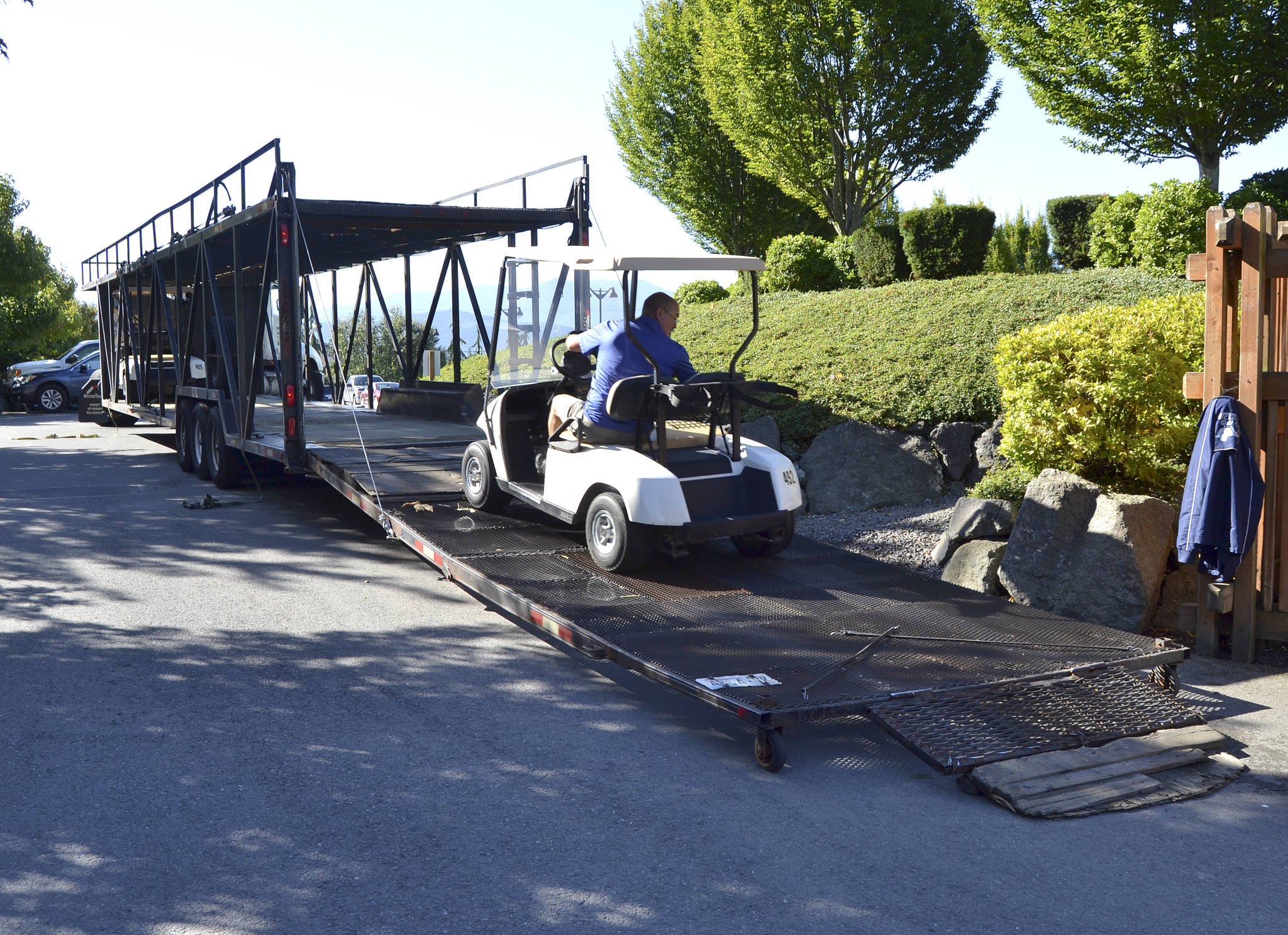 Following a fire that destroyed about 50 golf carts at the Cedars at Dungeness on Sept. 16, local golf courses including SkyRidge Golf Course and Peninsula Golf Club donated a few carts to borrow. Staff with Gold Mountain Golf Course in Bremerton, pictured, dropped off about 30 carts on Monday for the course to rent through the fall. Sequim Gazette photo by Matthew Nash