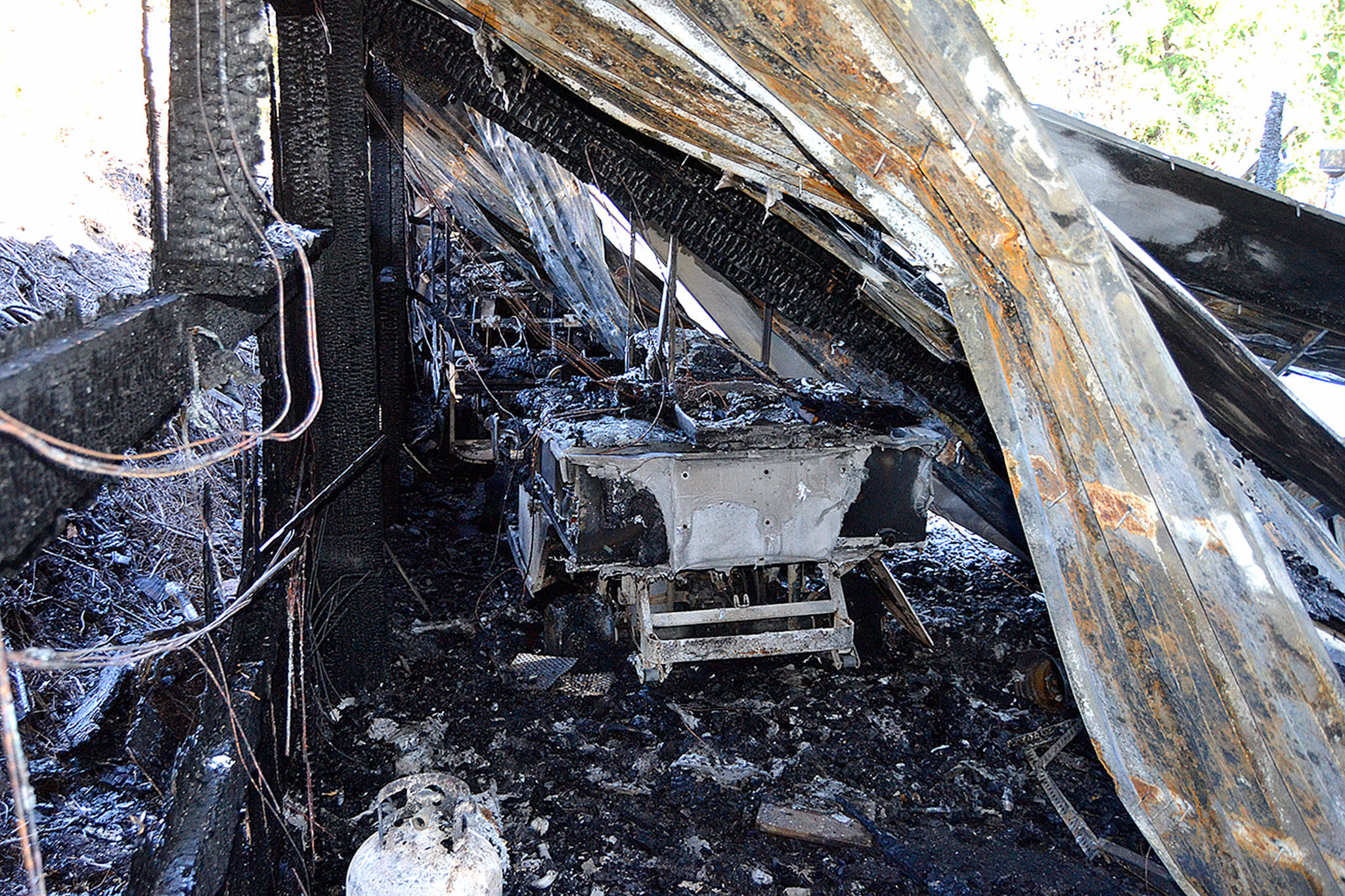 Staff with the Cedars at Dungeness estimate about 50 golf carts and other equipment were lost on Sunday, Sept. 16 in an early morning fire. No injuries were reported and the cause remains under investigation. Sequim Gazette photo by Matthew Nash