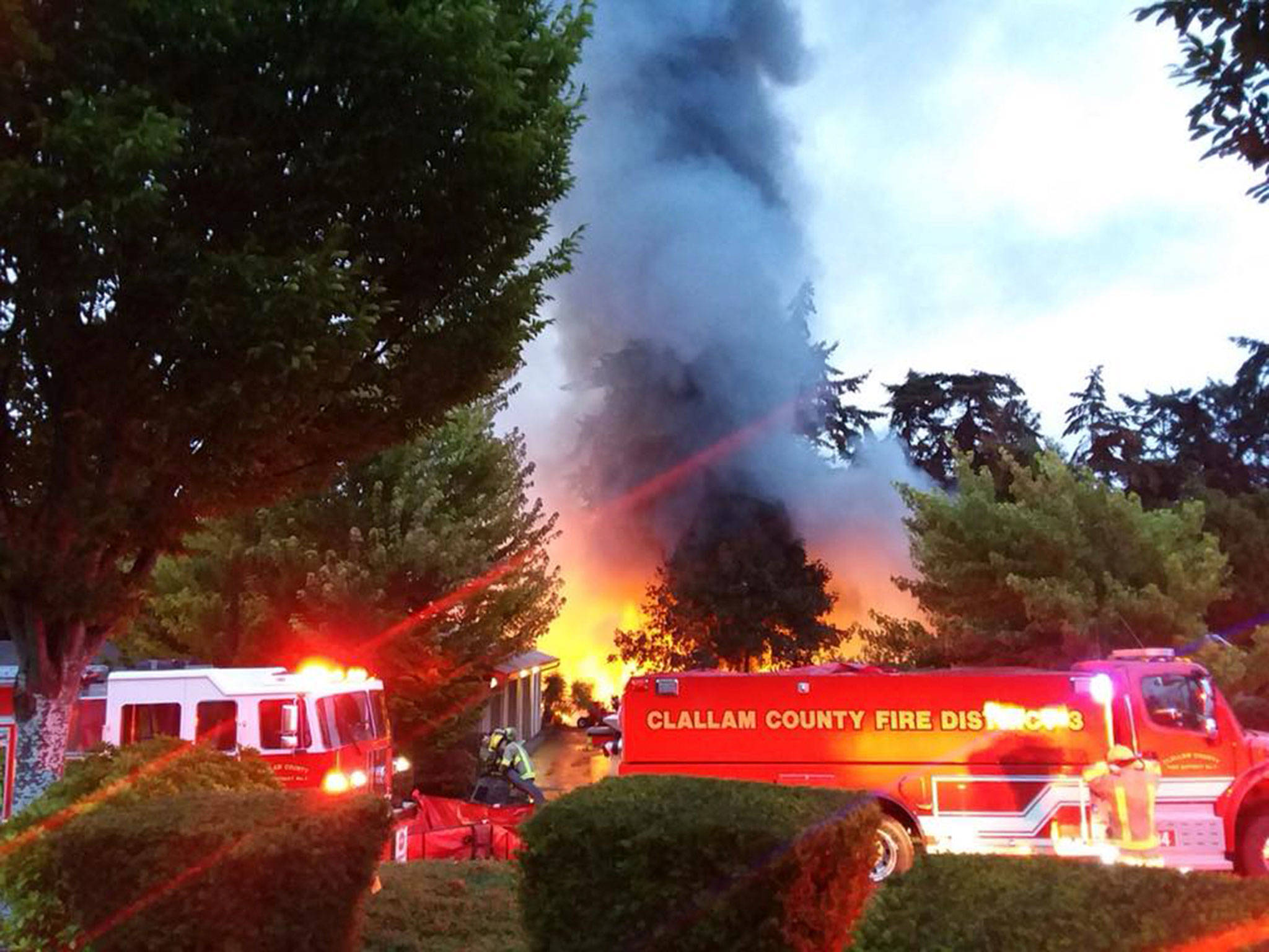 Fire crews with Clallam County Fire District 3 respond to Cedars at Dungeness early Sunday morning where an approximate 24-foot-by-100-foot building was on fire. An estimated 50 golf carts were destroyed.  Photo courtesy of Clallam County Fire District 3
