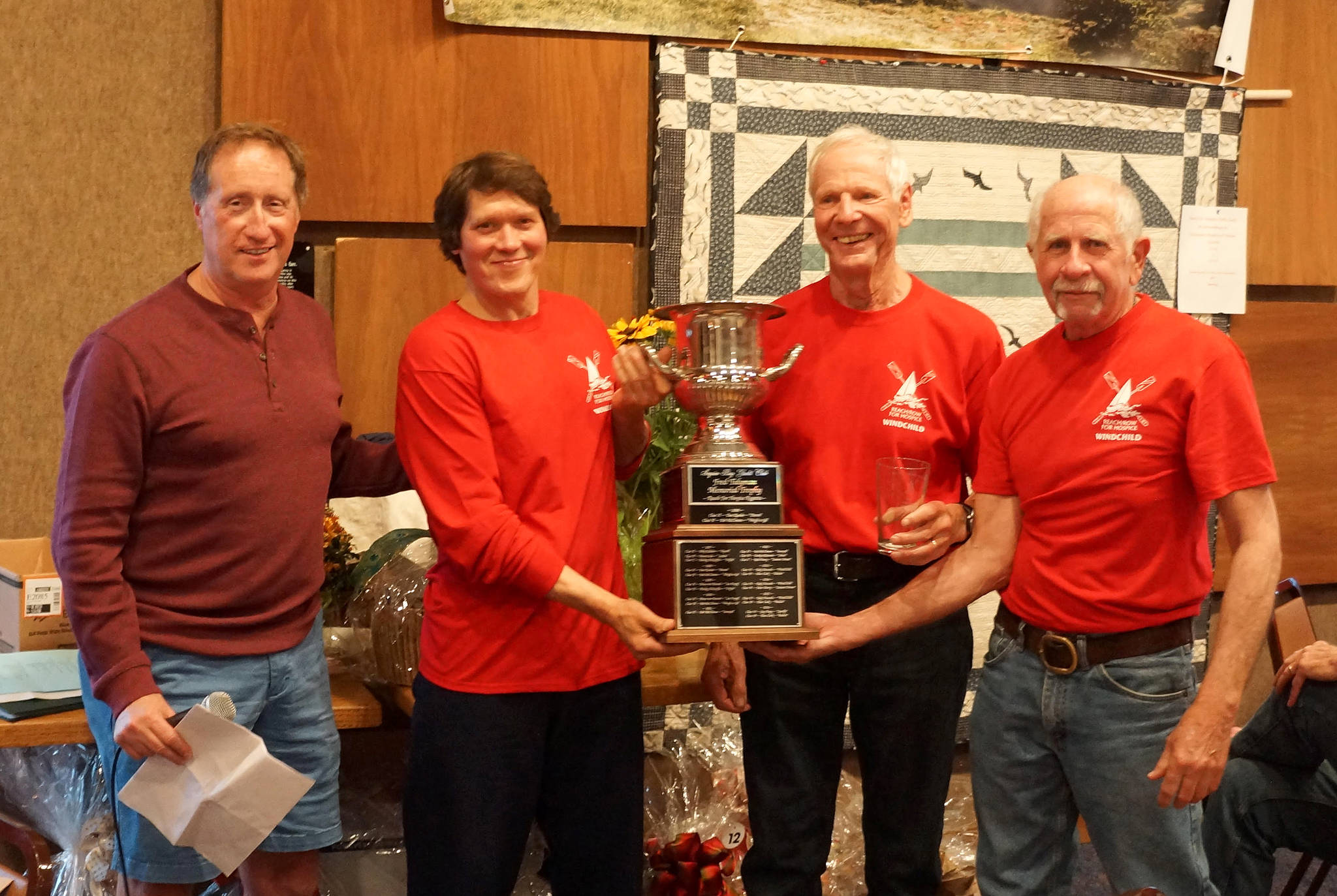 Skipper Rudy Hessels (second from right) and the crew of Wind Child celebrate a Division A win at the 2018 Reach for the Hospice on Sept. 15. Submitted photo