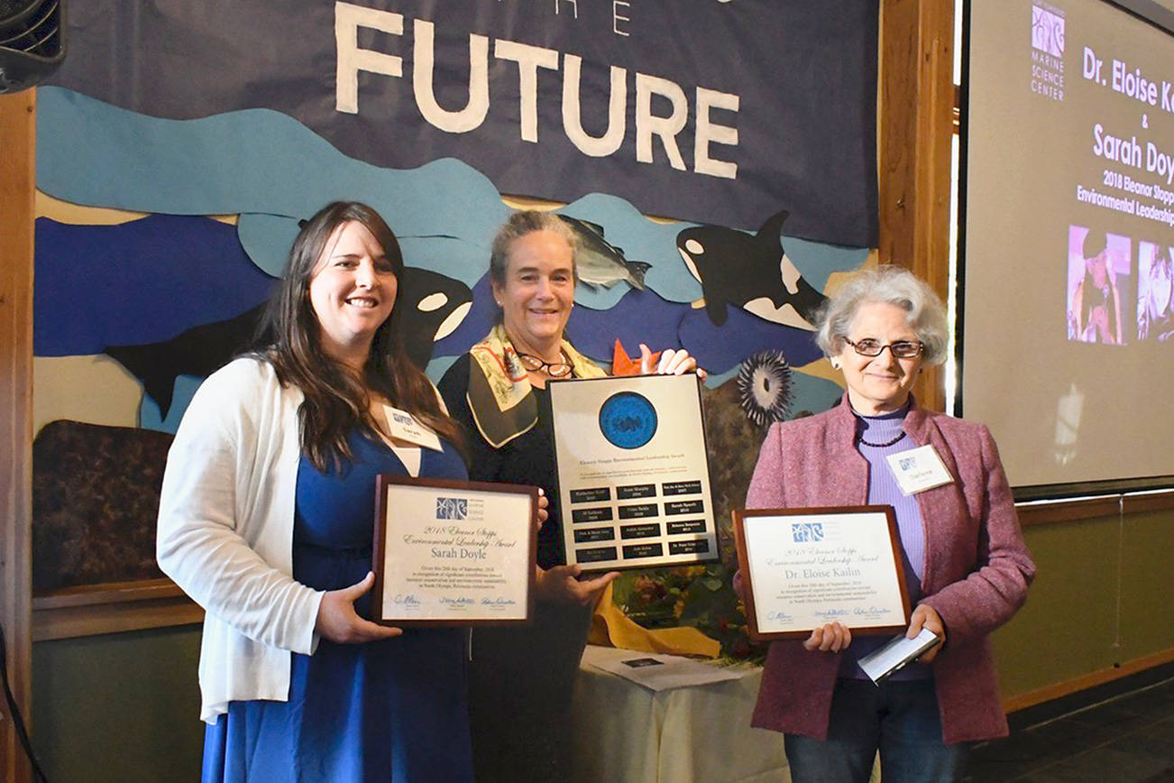 2018 Eleanor Stopps Environmental Leadership Awards were presented to Sarah Doyle (left), stewardship coordinator for the North Olympic Salmon Coalition and Dr. Eloise Kailin, Olympic Environmental Council co-founder. Port Townsend Marine Science Center Executive Director Janine Boire (center) presented the awards. Dr Kailin who was not present was represented by Darlene Schanfald, her fellow board member from Protect the Peninsula’s Future. (Jeannie McMacken/Peninsula Daily News)