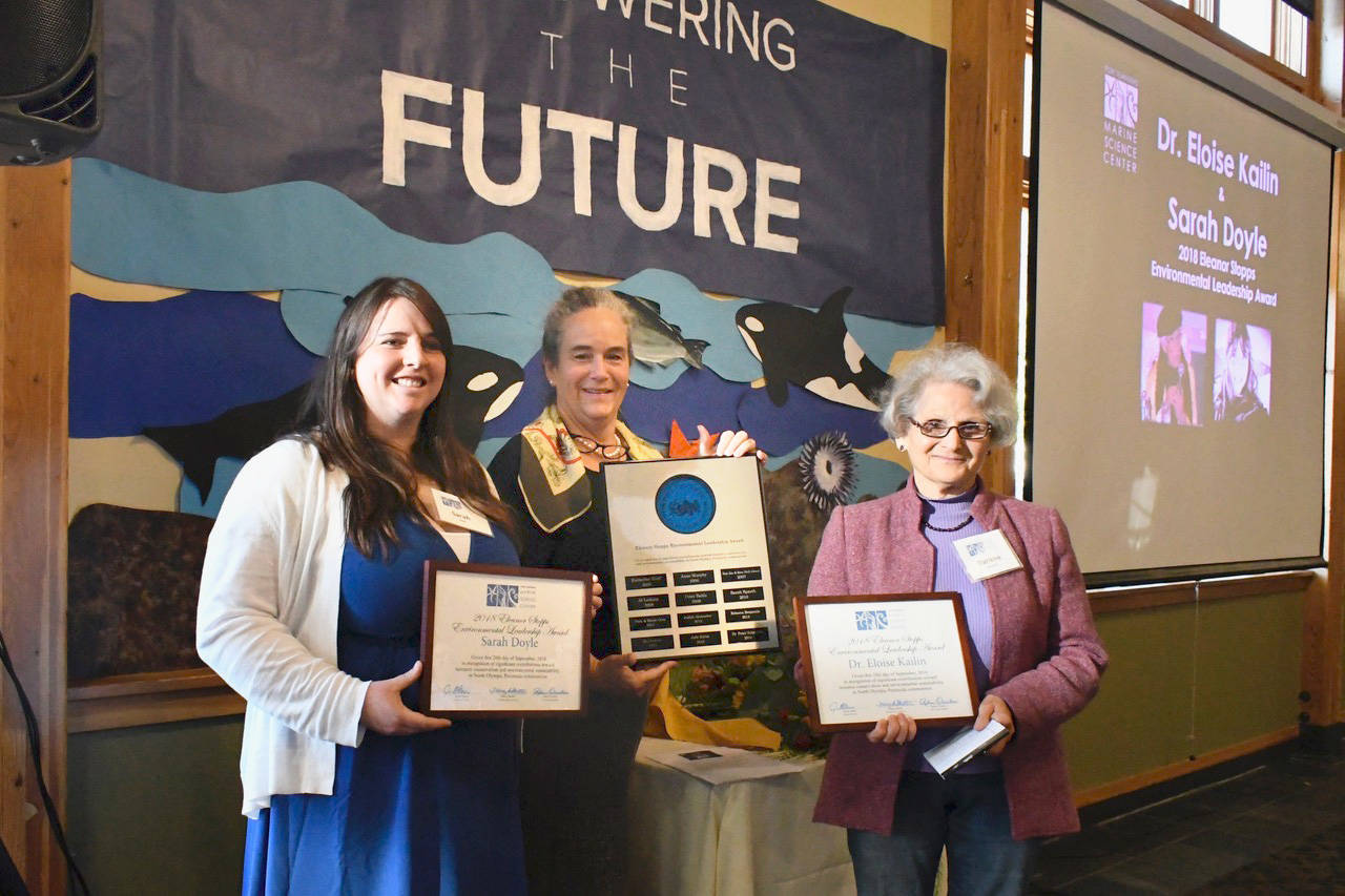 Eleanor Stopps Environmental Leadership Awards were presented to Sarah Doyle, left, stewardship coordinator for the North Olympic Salmon Coalition and Dr. Eloise Kailin, longtime activist. Janine Boire, executive director of the Port Townsend Marine Science Center, presented the awards. Kailin who was not present but was represented by Darlene Schanfald, her fellow board member from Protect the Peninsula’s Future. (Jeannie McMacken/Peninsula Daily News)