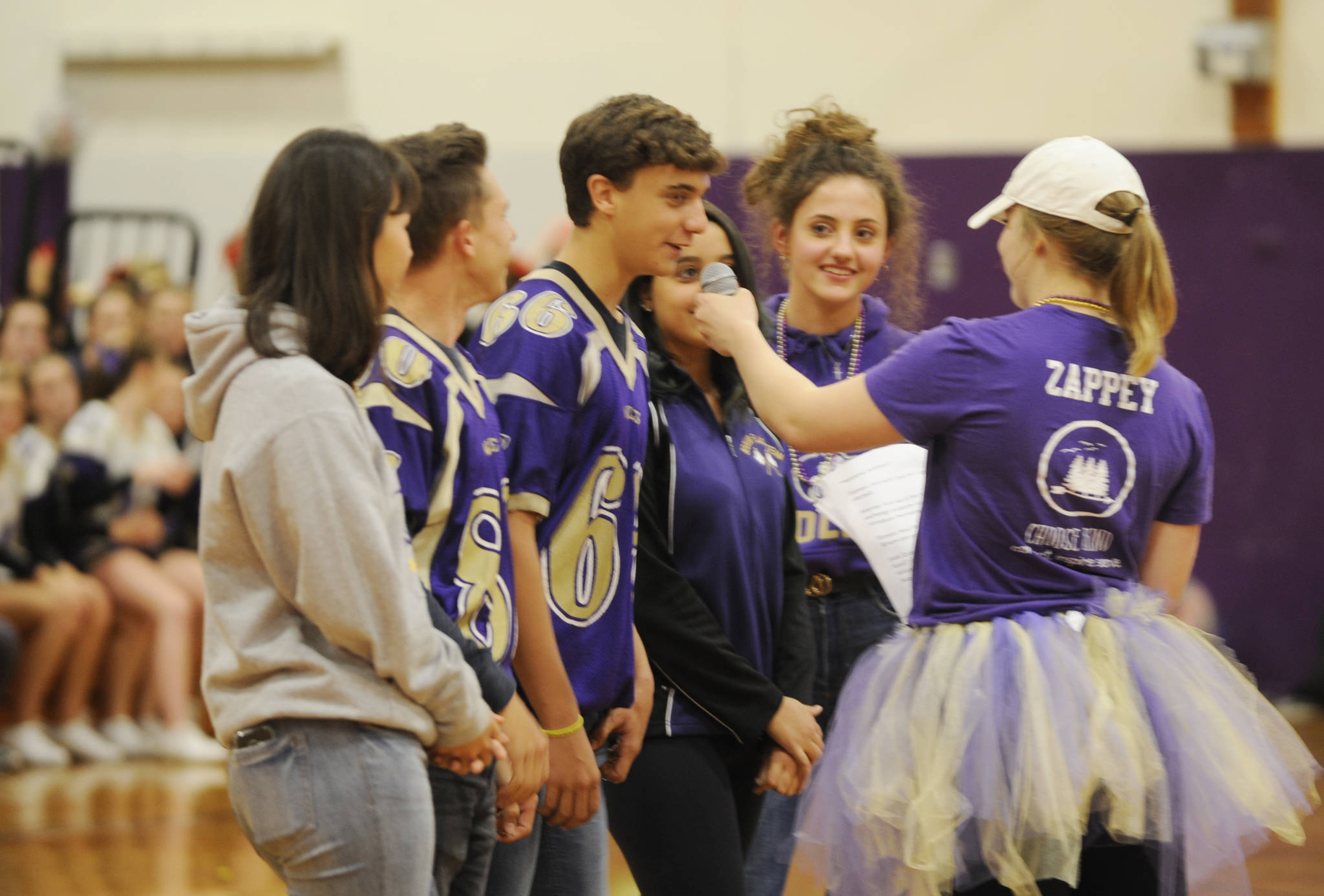 Saying hello to the Sequim High Homecoming assembly crowd are this year’s SHS exchange students: Khelea Cloetens and Mathys Tanche of Belgium, Rodrigo Silva Carrasco and Paula Martinez Saenz of Spain, Elisa Hieber of Germany, Isabella Lemos Platera of Brazil and Sofia Baruffi of Italy. Sequim Gazette photo by Michael Dashiell
