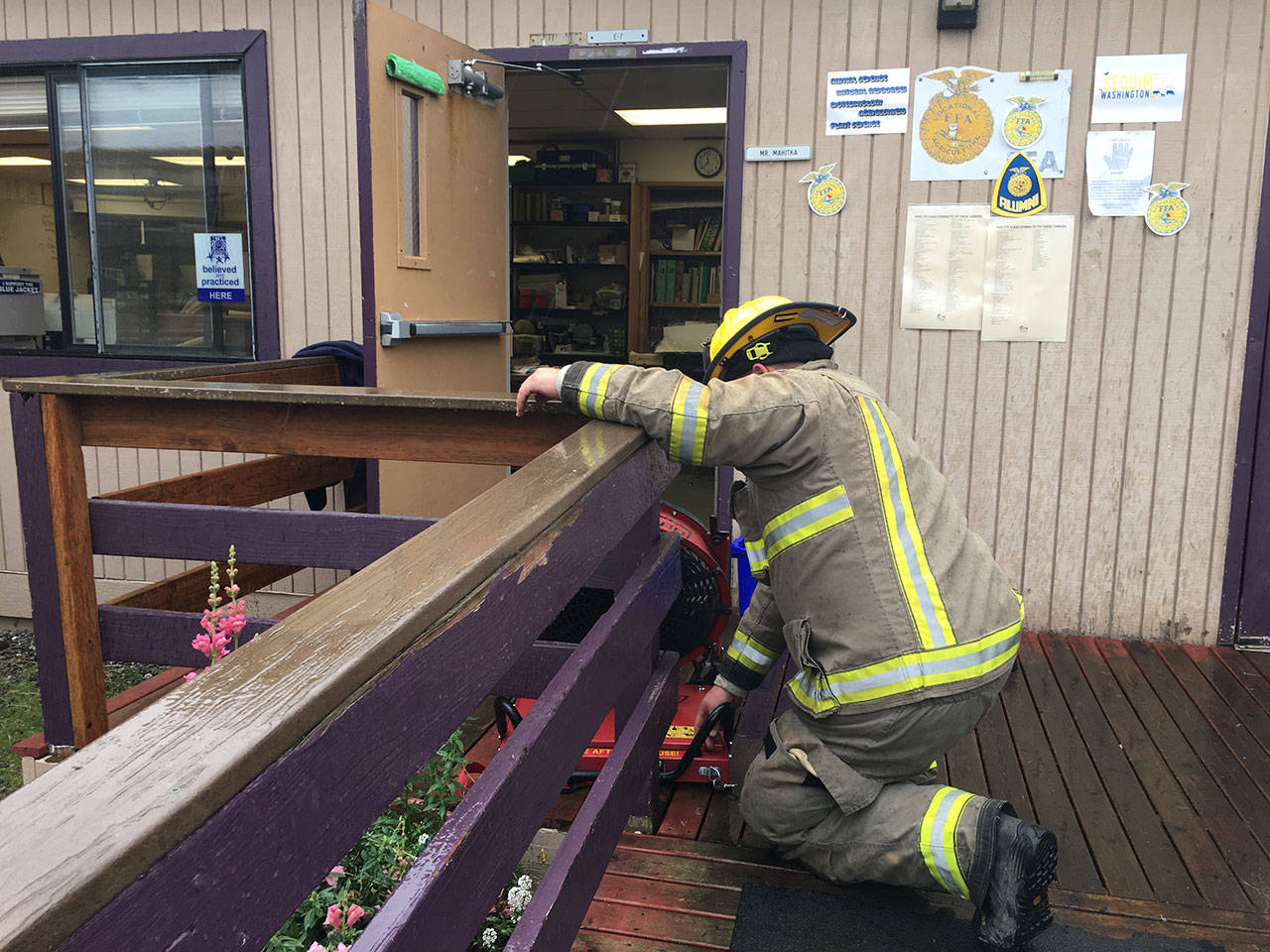 Firefighters with Clallam County Fire District 3 place fans outside this portable classroom at Sequim High School after a faulty heater started to smoke on Oct. 5. Sequim Gazette photo by Matthew Nash