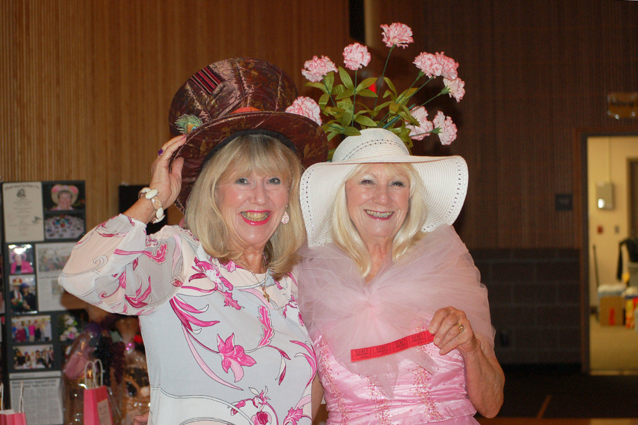Locals Kathryn Haskell, left, and her friend Marian Fine, sport their “pretty in pink” attire and creative hats at the 21st annual Mad Hatters Tea party and luncheon on Oct. 5. The event raises awareness for breast cancer and funds to support breast cancer organizations. Sequim Gazette photo by Erin Hawkins