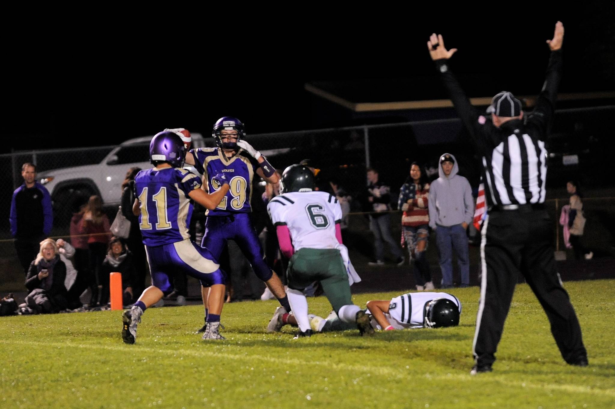 Sequim’s Michael Young (11) and Joey Oliver (29) celebrate a touchdown in the Wolves’ rivalry win over Port Angeles on Oct 12. Sequim Gazette photo by Matthew Nash