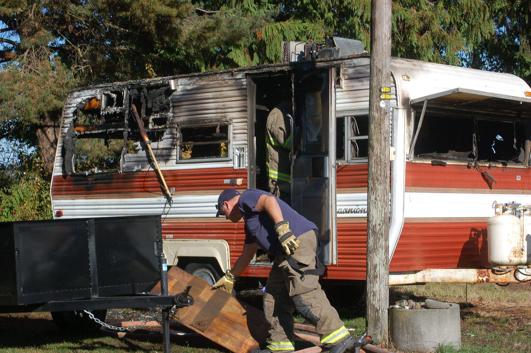 Firefighters from Clallam County Fire District 3 responded to a propane explosion at about 2:25 p.m. on Oct. 16 that caused a fire to ignite in an 18-foot travel trailer at the 800 block of West Hendrickson Road in Sequim. Sequim Gazette photo by Erin Hawkins