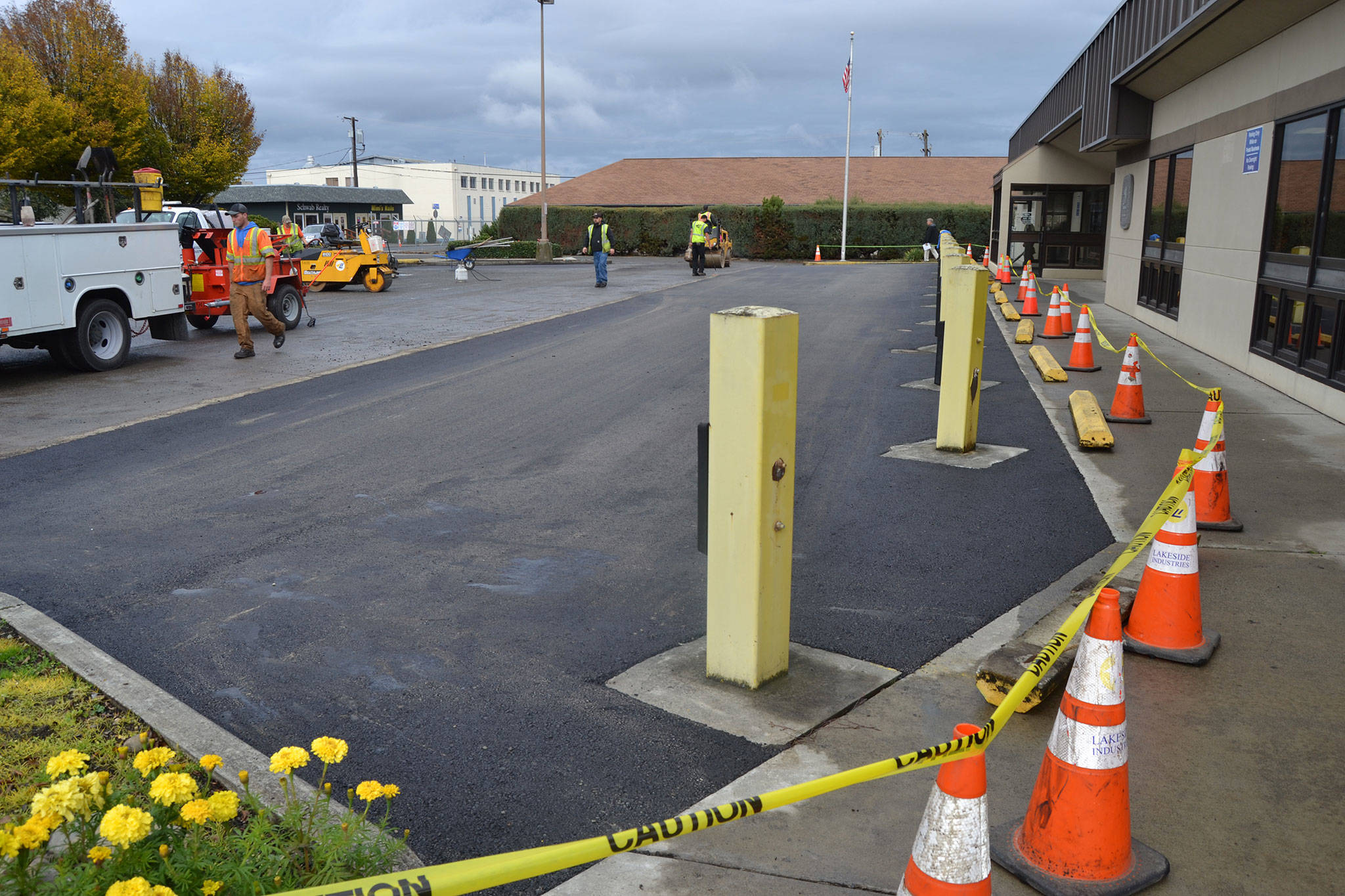 On Oct. 31-Nov. 1, Lakeside Industries resurfaced a portion of the Sequim Post Office’s parking lot that has been deteriorating in recent years. Sequim Gazette photos by Matthew Nash
