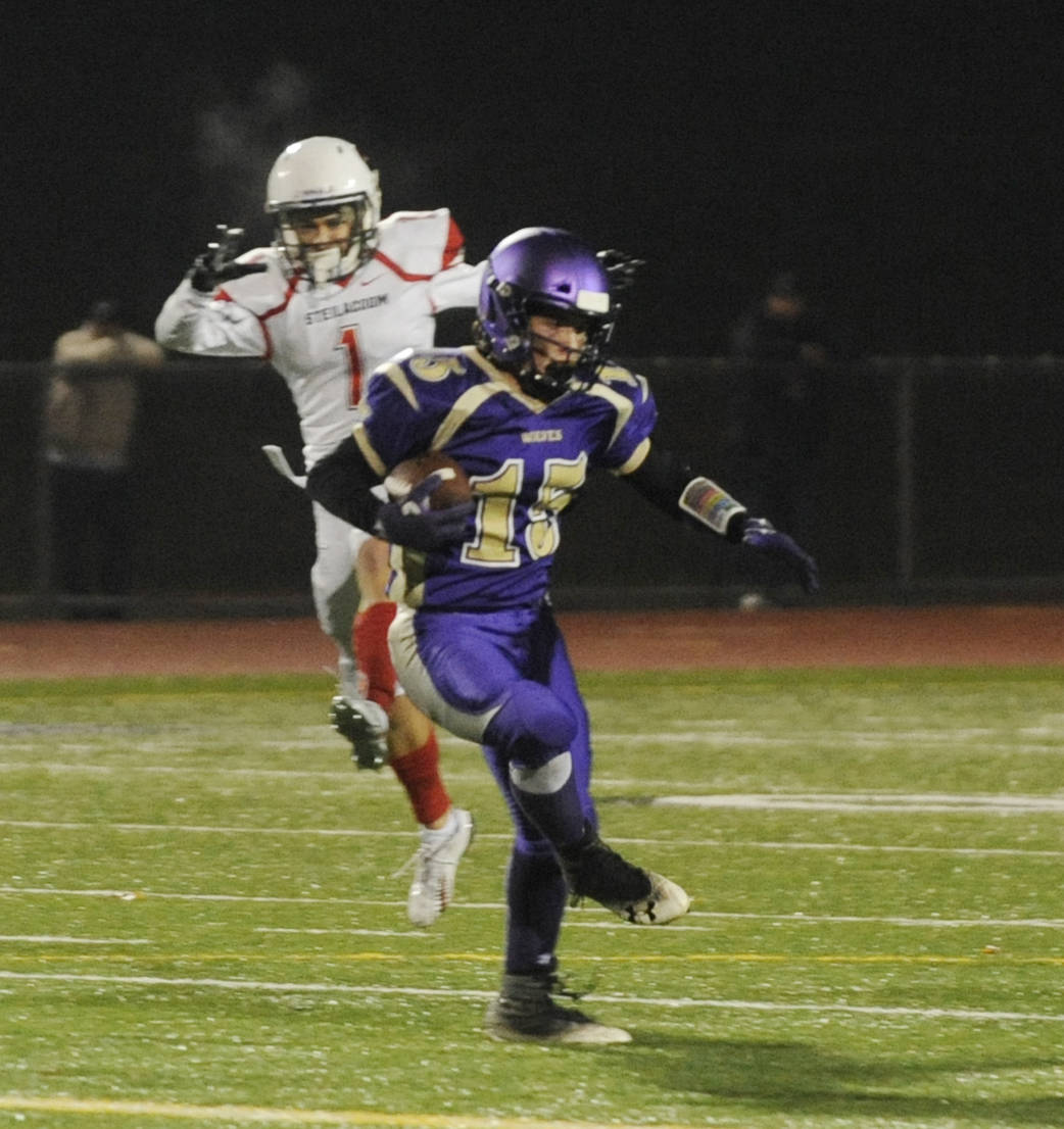 Sequim safety Taig Wiker intercepts a pass from Steilacoom quarterback J.J. Lemmings in the first quarter of the Wolves’ 49-12 loss in the first round of the state 2A tournament in Silverdale on Nov. 9. Sequim Gazette photo by Michael Dashiell
