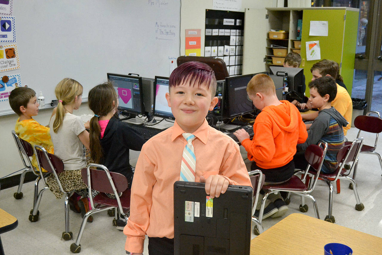 At 8-years-old, Port Angeles’ Aiden Johnson continues to build computers for people in-need with the Sequim PC Users Group. Through the group’s help, he also helped start Roosevelt Elementary School’s Computer Club. Sequim Gazette photo by Matthew Nash