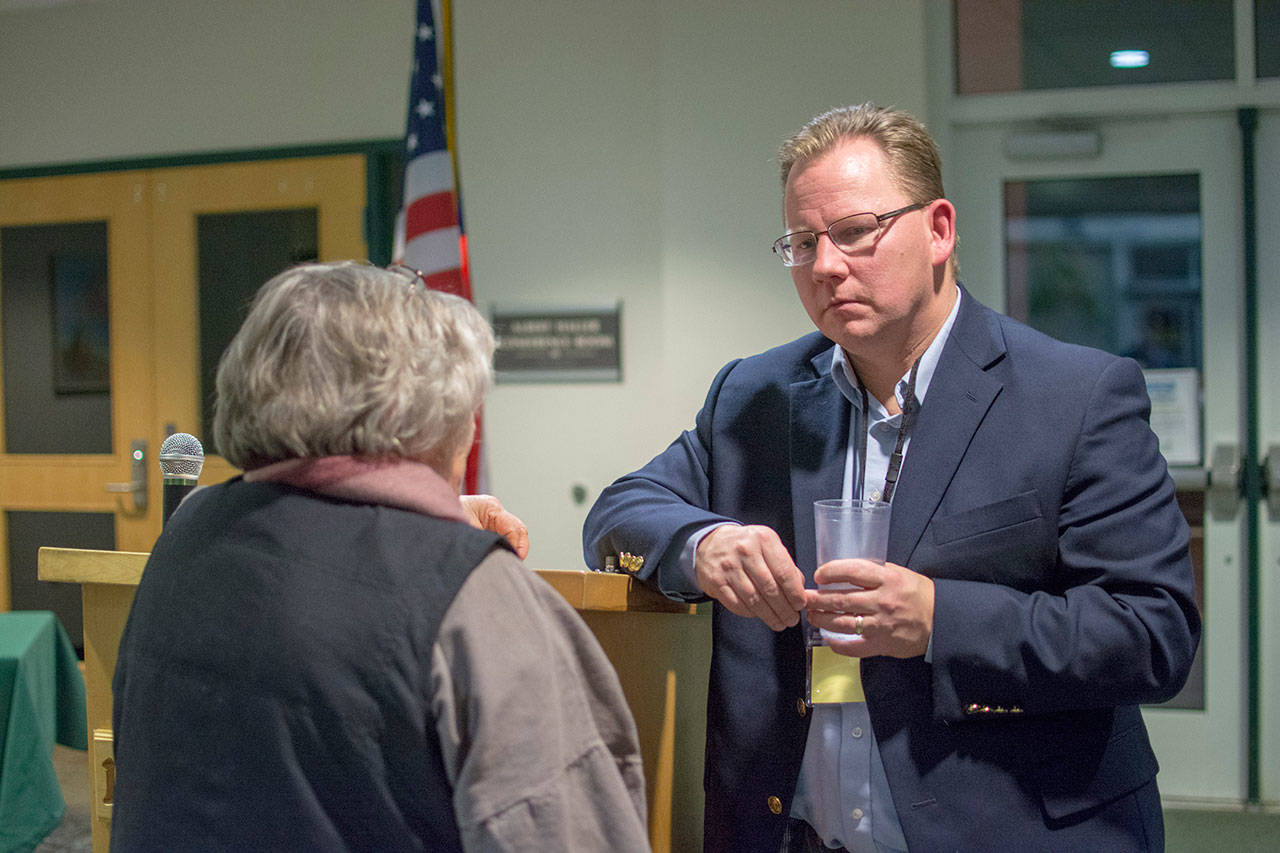 State Superintendent of Public Instruction Chris Reykdal talks with Port Angeles School Board Director Sandy Long on Monday. (Jesse Major/Peninsula Daily News)