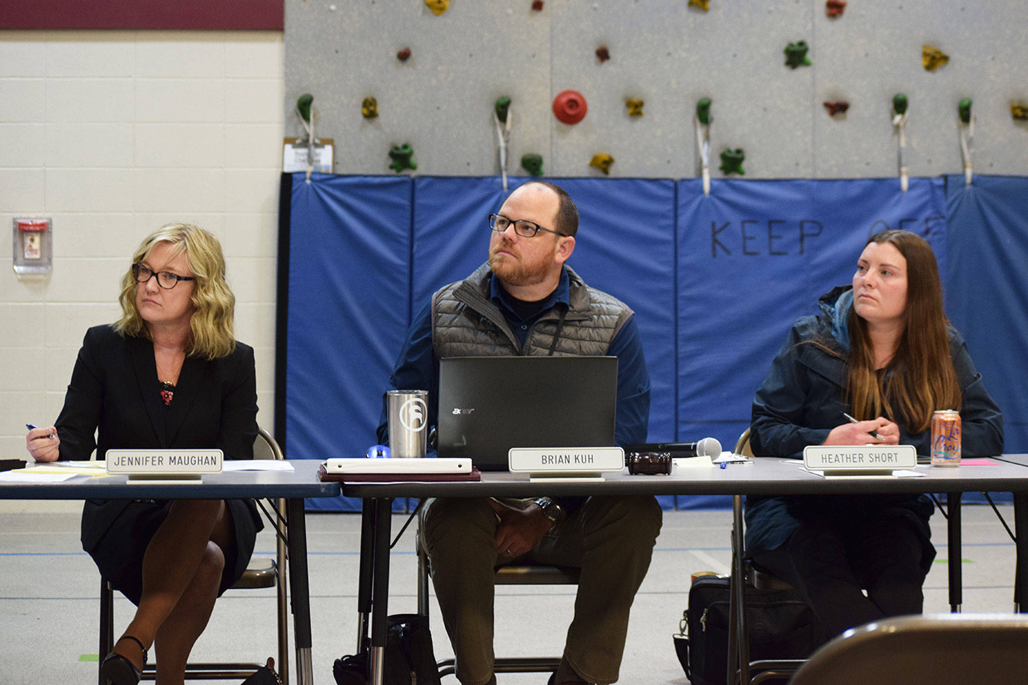 Sequim School District assistant superintendent Jennifer Maughan, left, school board president Brian Kuh, and board director Heather Short, listen as parents, teachers, and students express concerns for not enough classroom space at Greywolf Elementary School and facility issues at Olympic Peninsula Academy’s six portables at a board meeting on Nov. 19. Sequim Gazette photo by Erin Hawkins