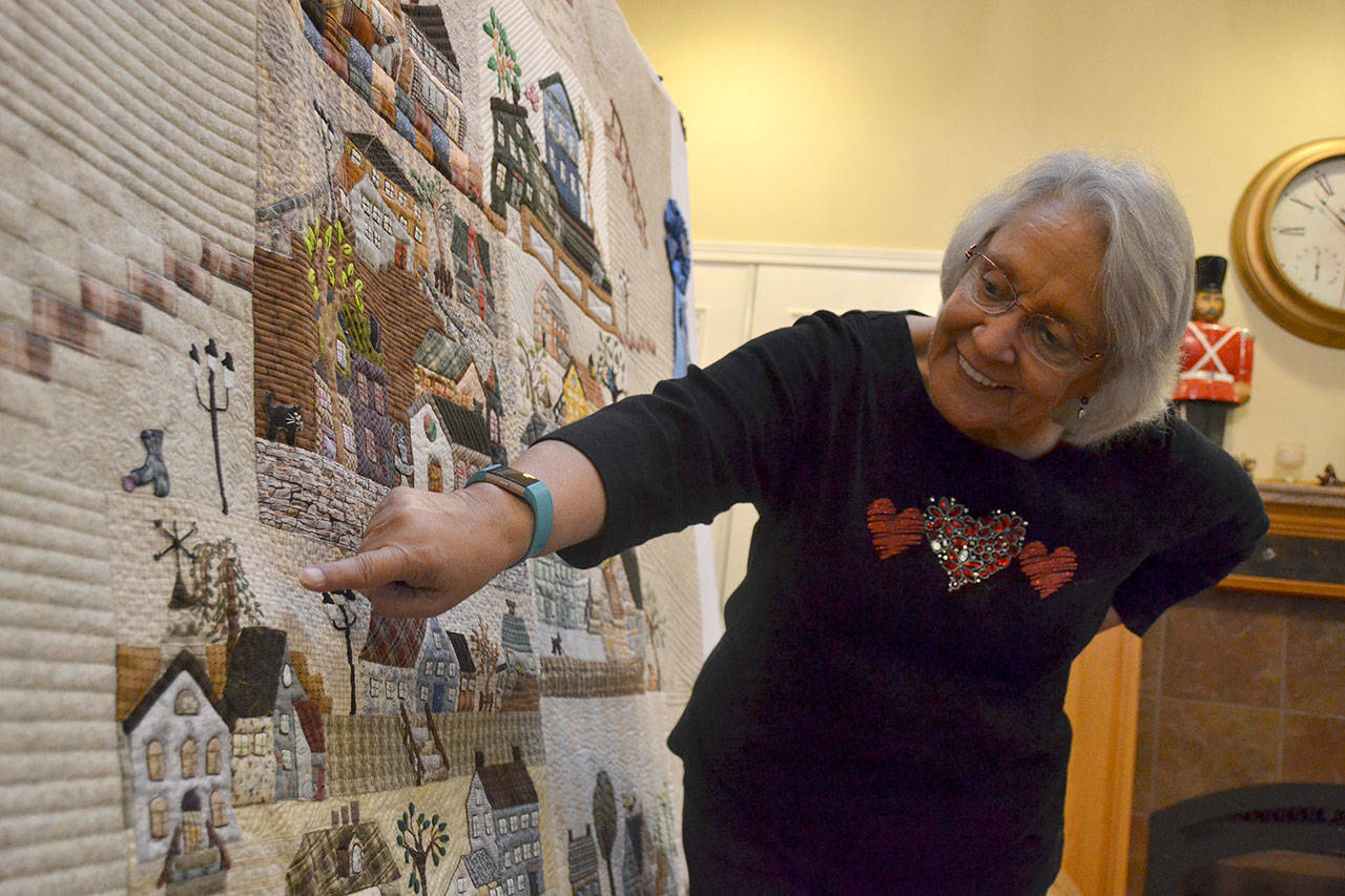 Sequim’s Martha Scott, 72, won first place for “Enchanted Village” in the “Wall Hanging Hand Appliqué” category at the Fall Paducah show in September, which she says is like the Olympics of quilting. Sequim Gazette photo by Matthew Nash