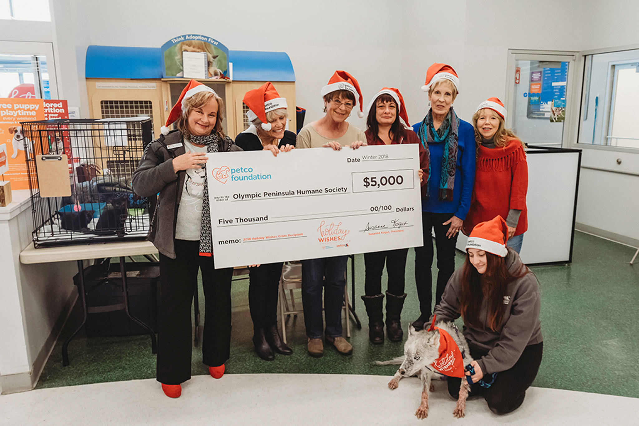 The Petco Foundation awarded the Olympic Peninsula Humane Society (OPHS) a $5,000 grant through the Foundation’s sixth annual Holiday Wishes campaign, an opportunity for individuals or organizations around the country to share how an adopted pet has changed their lives. From left, OPHS Executive Director, Luanne Hinkle, Linda Crow, Becky Upton, Denise Foley, Donna Halsaver, Theresa Killgore, and Brooke Horn hold the grant check at the Sequim Petco on Dec. 1. Photo courtesy of Brandie Ballard Photography