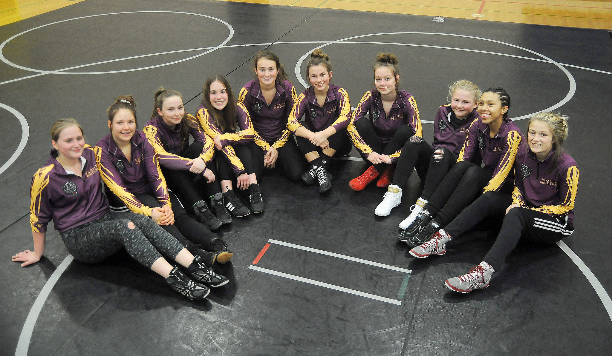 From left, Sequim High girls wrestling team members include, from left, Aleah Chen, Brooke Hodges, Skye Henning, Jordan Hegtvedt, Amara Sayer, Alexi Rampp-Taft, Kaydence Hilliard, Petra Bernsten, Chayil Briggs and Emily Dodson. Not pictured is Lilly Peterson. Sequim Gazette photo by Michael Dashiell