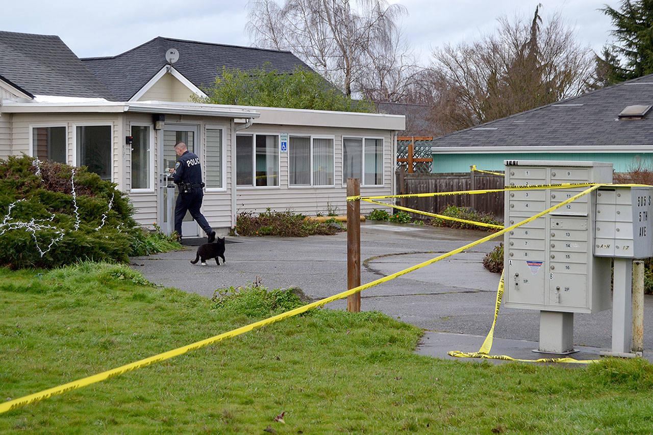 Sgt. John Southard with Sequim Police Department enters the Sunbelt Apartments on Thursday morning during an investigation into the death of a 57-year-old Sequim resident. Sequim Gazette photo by Matthew Nash