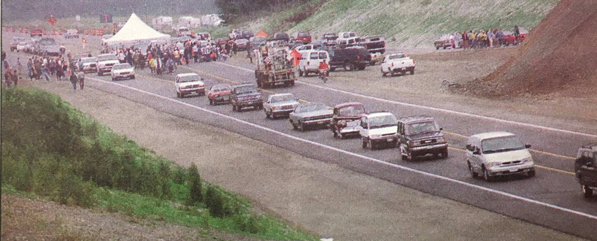 Various vehicles line up for a ceremony to honor the opening of Sequim’s new bypass in August 1999. Plans were in place to finish the Simdars Road Interchange but state funding led the Department of Transportation to leave the project half finished. Sequim Gazette file photo