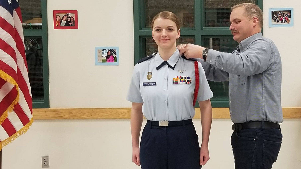 Madeline Patterson getting her new rank insignia from her father Jake on Jan. 8. Photo courtesy of Danielle Patterson