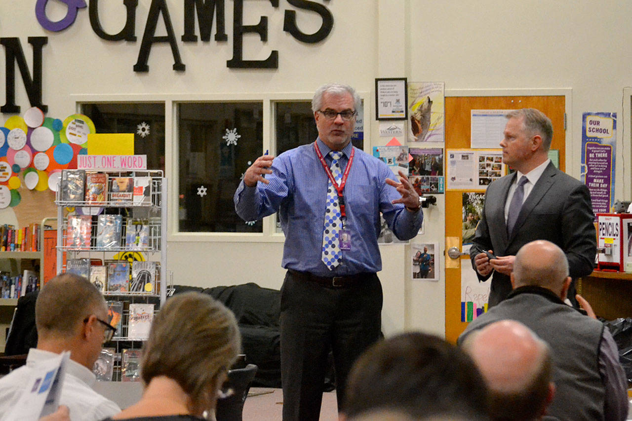 Sequim School District’s superintendent Gary Neal stands with Trevor Carlson, managing director for PiperJaffray, on Jan. 14, where a forum served as a kickoff for discussions on future construction needs and bond and levy options. Sequim Gazette photo by Matthew Nash