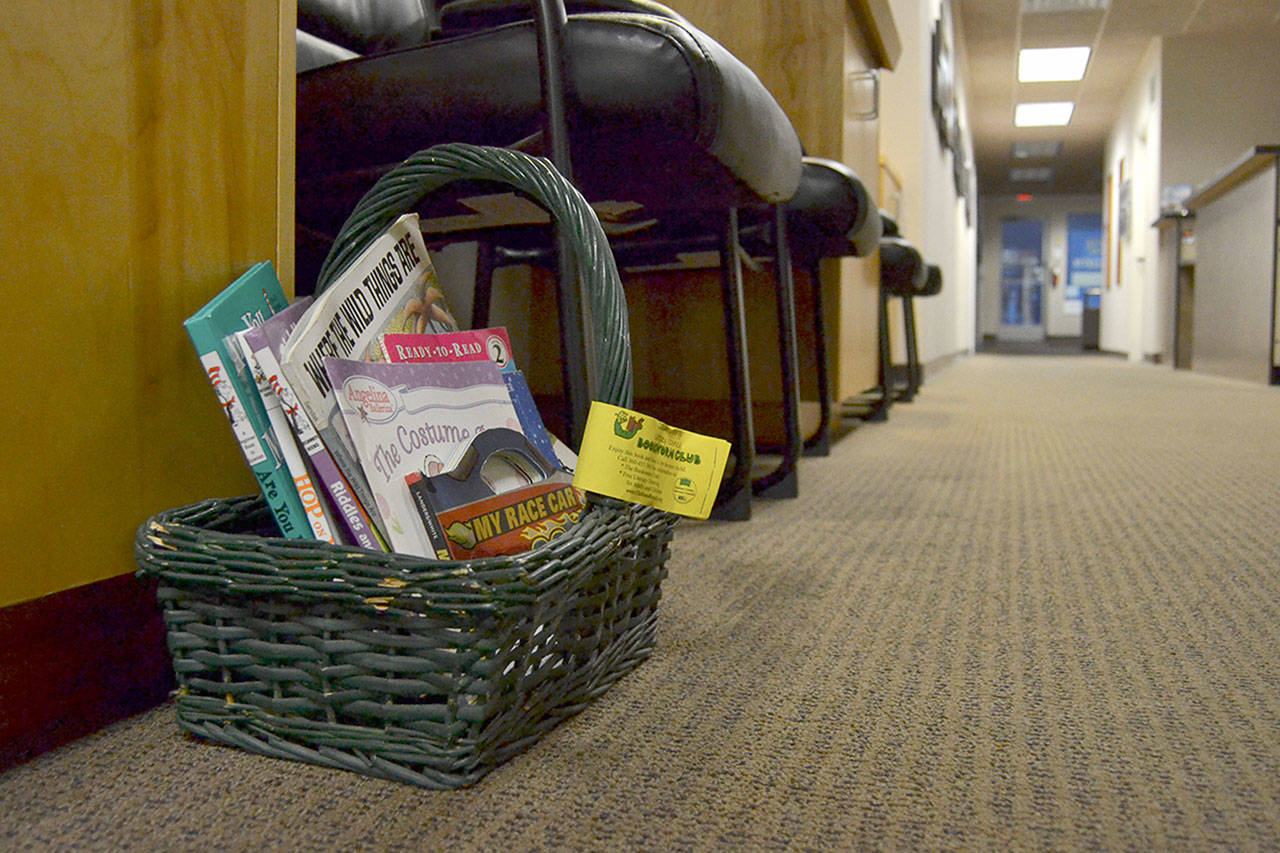 More than 200 baskets with about 10 books sit in offices across Clallam County providing children opportunities to read thanks to the Clallam County Literacy Council and Jo Ann Thompson of Sequim who helps lead basket distribution. Sequim Gazette photo by Matthew Nash