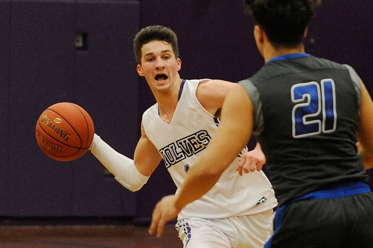 Boys basketball: Sequim surges, slips in loss to Roughriders