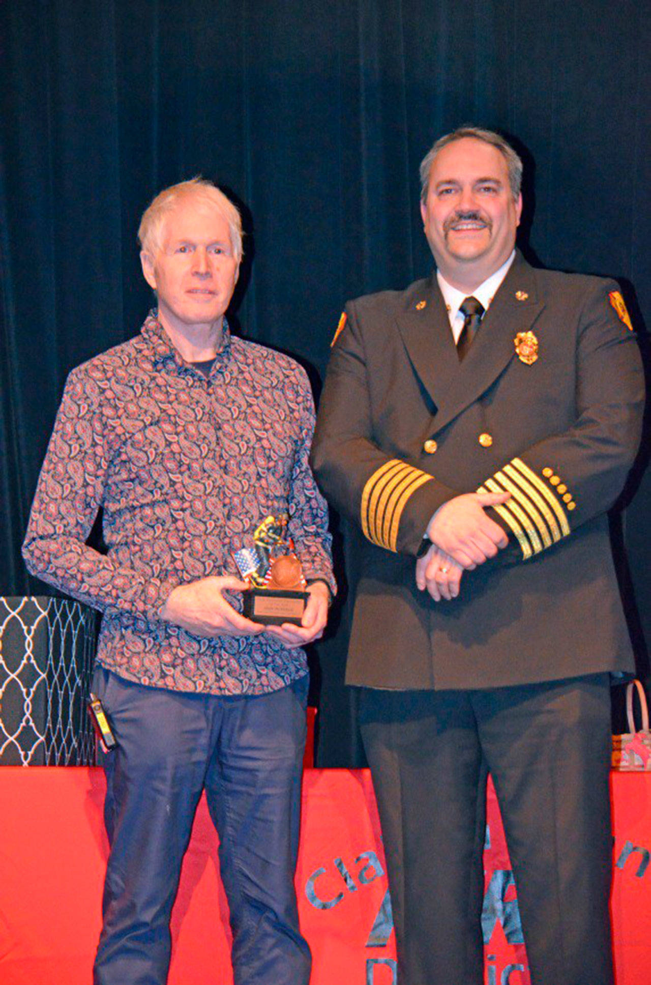 John McKenzie received the Volunteer Firefighter of the Year award in January from Fire Chief Ben Andrews. He was selected by a committee of peers after nominations for his accomplishments. Photo courtesy of Clallam County Fire District 3