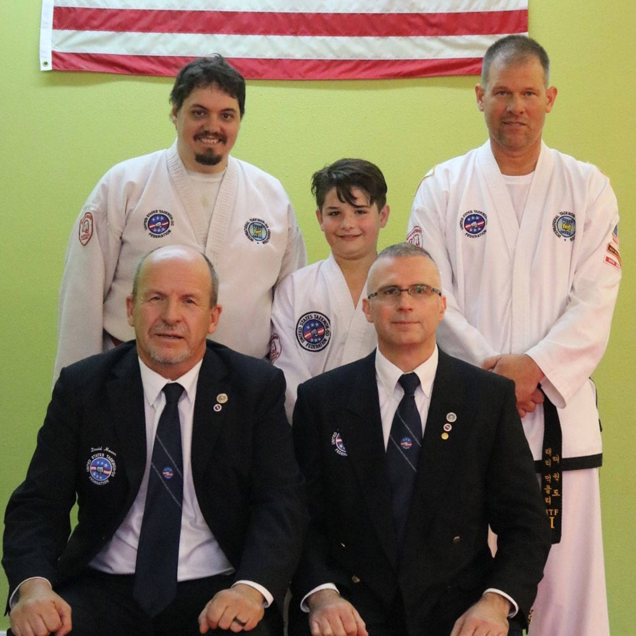 Three athletes from Bodystrong Academy earn black belts
