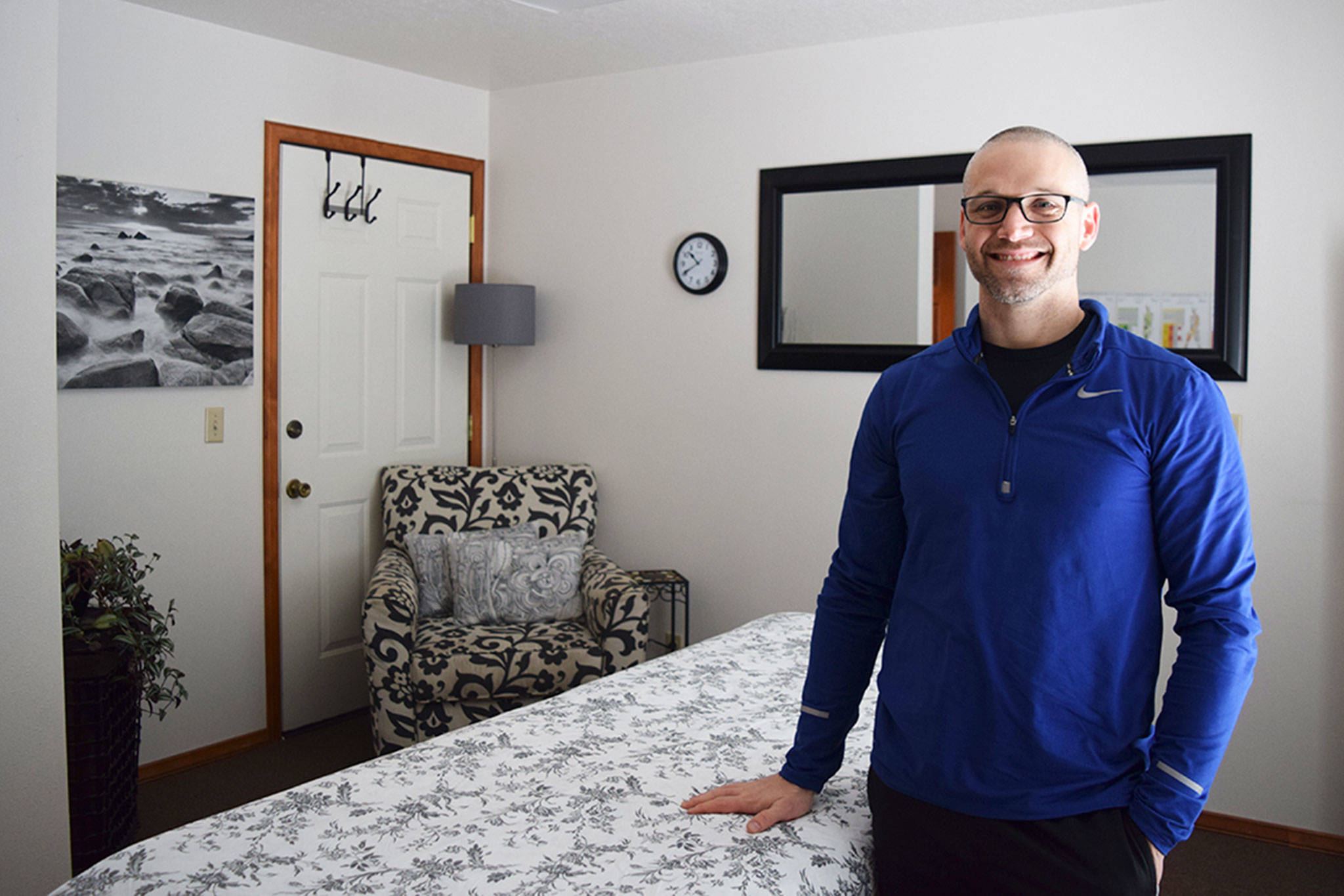 Kevin Pedrey stands in his new Northwest Fitness LLC massage therapy room at 720 E. Washington St., unit 108. Sequim Gazette photo by Erin Hawkins