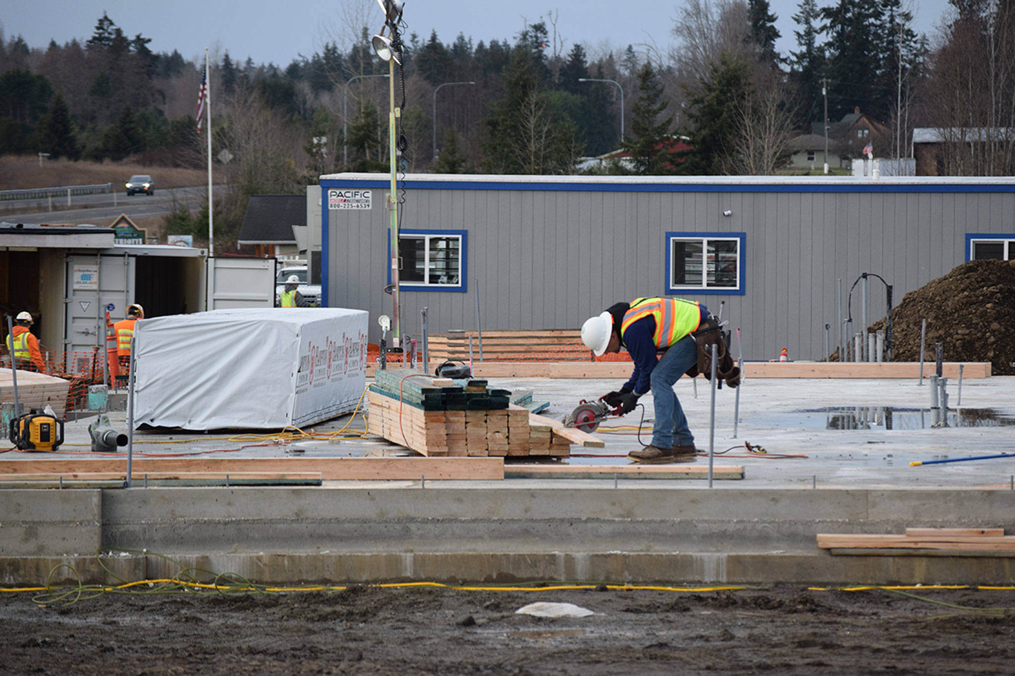 Construction crews continue to build an Arco gas station and 3,100 square foot ampm store on Carlsborg Road and U.S. Highway 101. Sequim Gazette file photo by Erin Hawkins