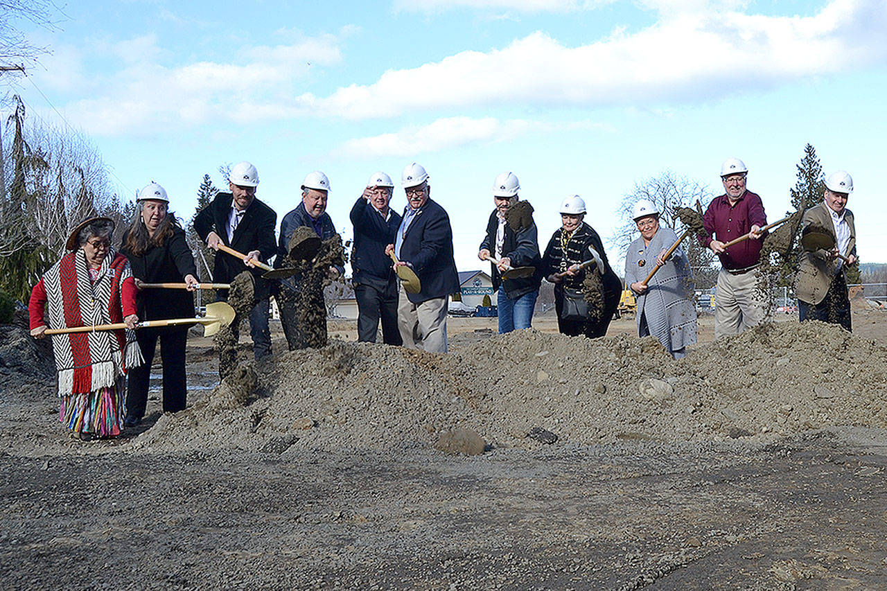 Dignitaries with the Jamestown S’Klallam Tribe gather for a ceremonial first dig for the 7 Cedars Casino and Resort expansion on Feb. 28 in Blyn. Sequim Gazette photo by Matthew Nash