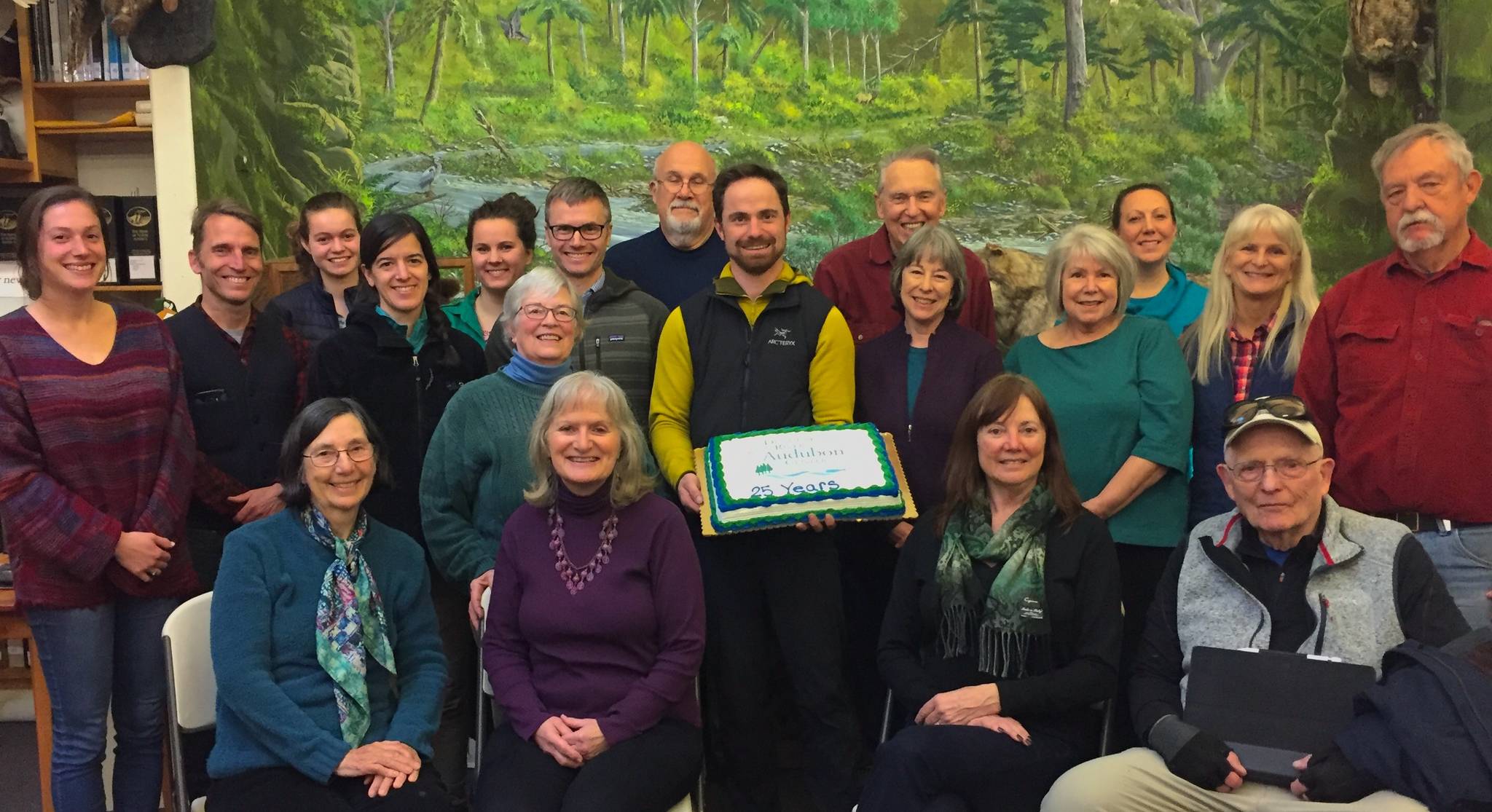 Dungeness River Center Board members celebrate the 25th anniversary of its incorporation as a nonprofit organization. Pictured are (back row, from left) education coordinator Jenna Ziogas, Neil Harrington, Vita Olson, Sara Cendeja-Zarelli, Alissa Lofstrom, Shirley Anderson, president Greg Voyles, vice president Dennis Dickson, director Powell Jones, Carl Siver, Darcy McNamara, treasurer Wanda Schneider, administrative manager Vanessa Fuller, Annette Nesse and Bob Phreaner, with (front row, from left) Lyn Muench, Annette Hanson, secretary Ann Sargent and Ken Weirsma. Photo courtesy of Dungeness River Audubon Center