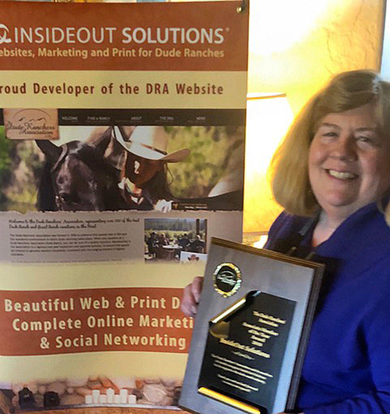 Patricia McCauley, president/CEO of Sequim’s InsideOut Solutions, shows off the company’s 2019 Vendor of the Year Award from the Dude Ranchers’ Association. Submitted photo                                Jack Waknitz and Beth Edwards, web development and design staff with InsideOut Solutions, show off the company’s 2019 Vendor of the Year Award from the Dude Ranchers’ Association. Submitted photo