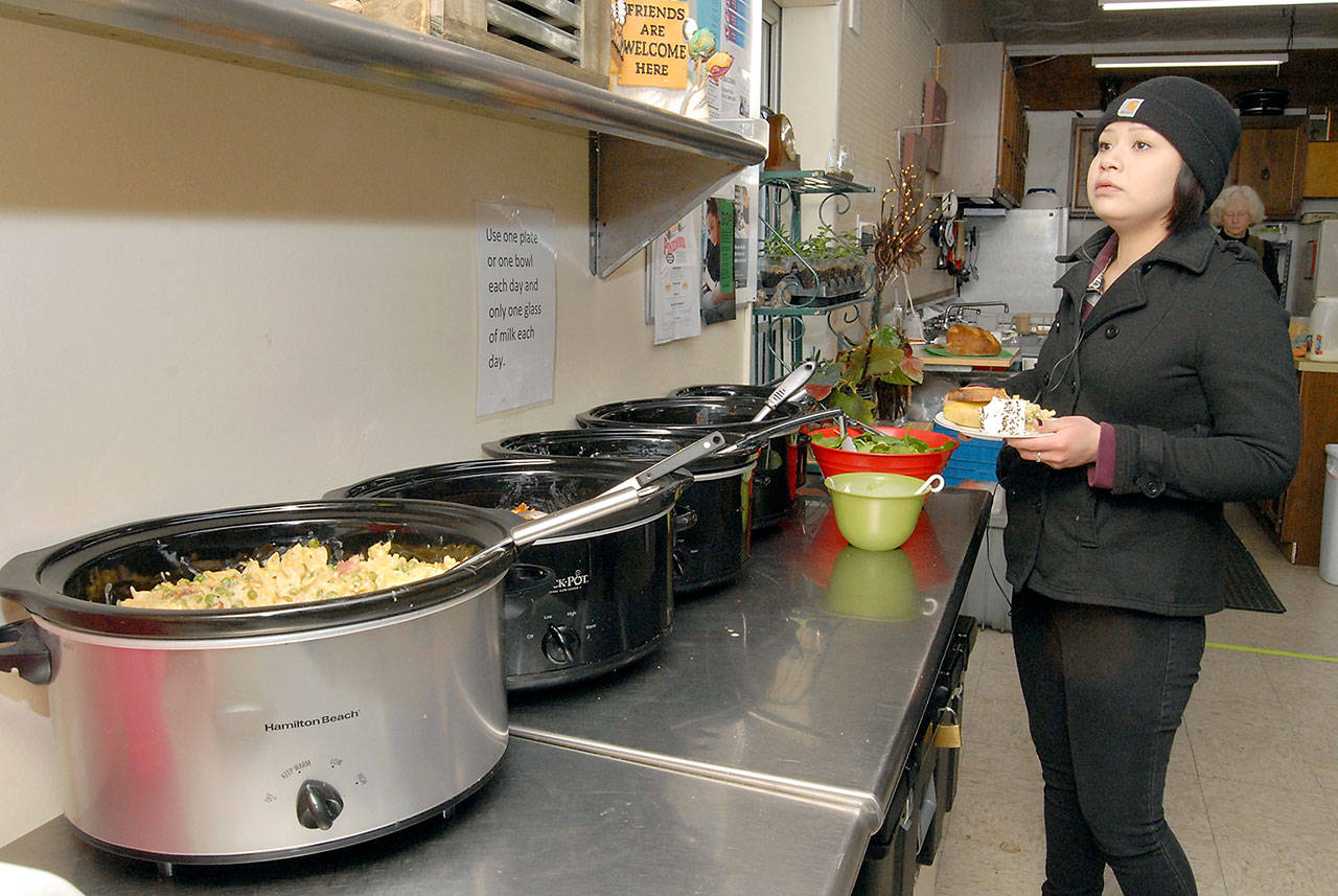 Lydia Stephan, 25, gets a plate of food at The Answer For Youth (TAFY) — one of several organizations approved to receive funding from Clallam County — on Feb. 27. Photo by Keith Thorpe/Peninsula Daily News